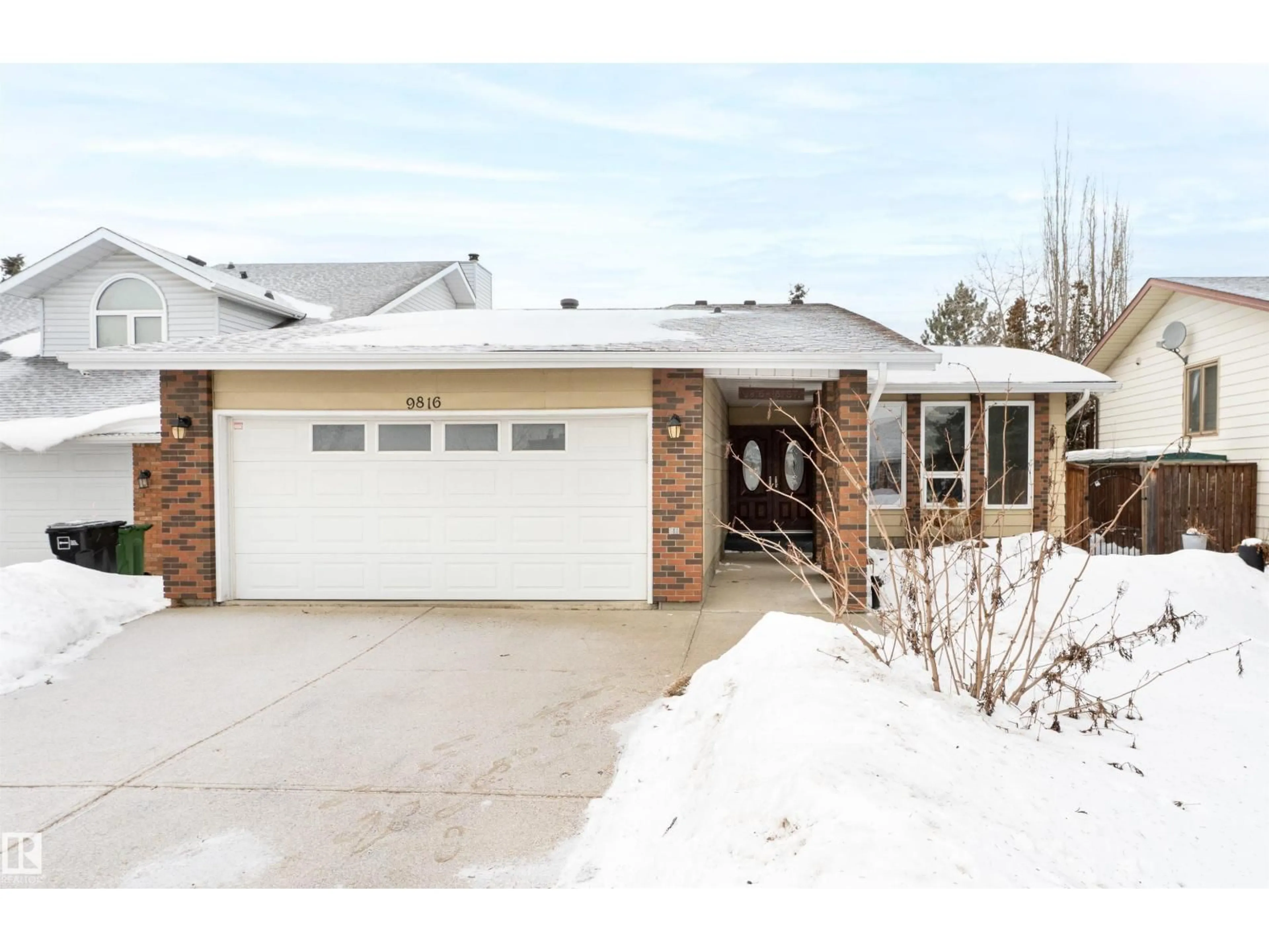 Home with brick exterior material, street for NW - 9816 181 ST, Edmonton Alberta T5T3H9