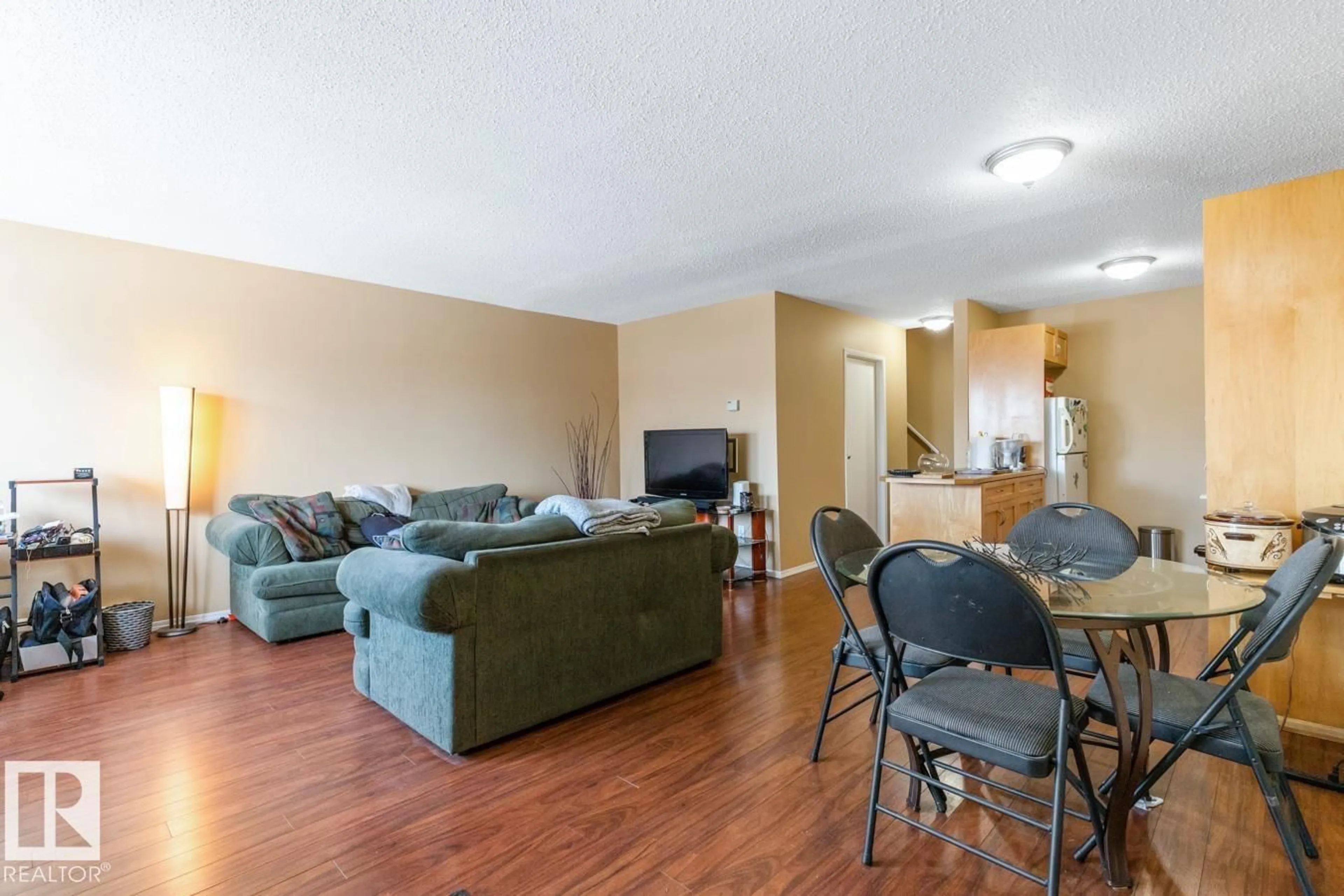 Living room with furniture, wood/laminate floor for 19 - 13580 38 ST NW, Edmonton Alberta T5A2W7