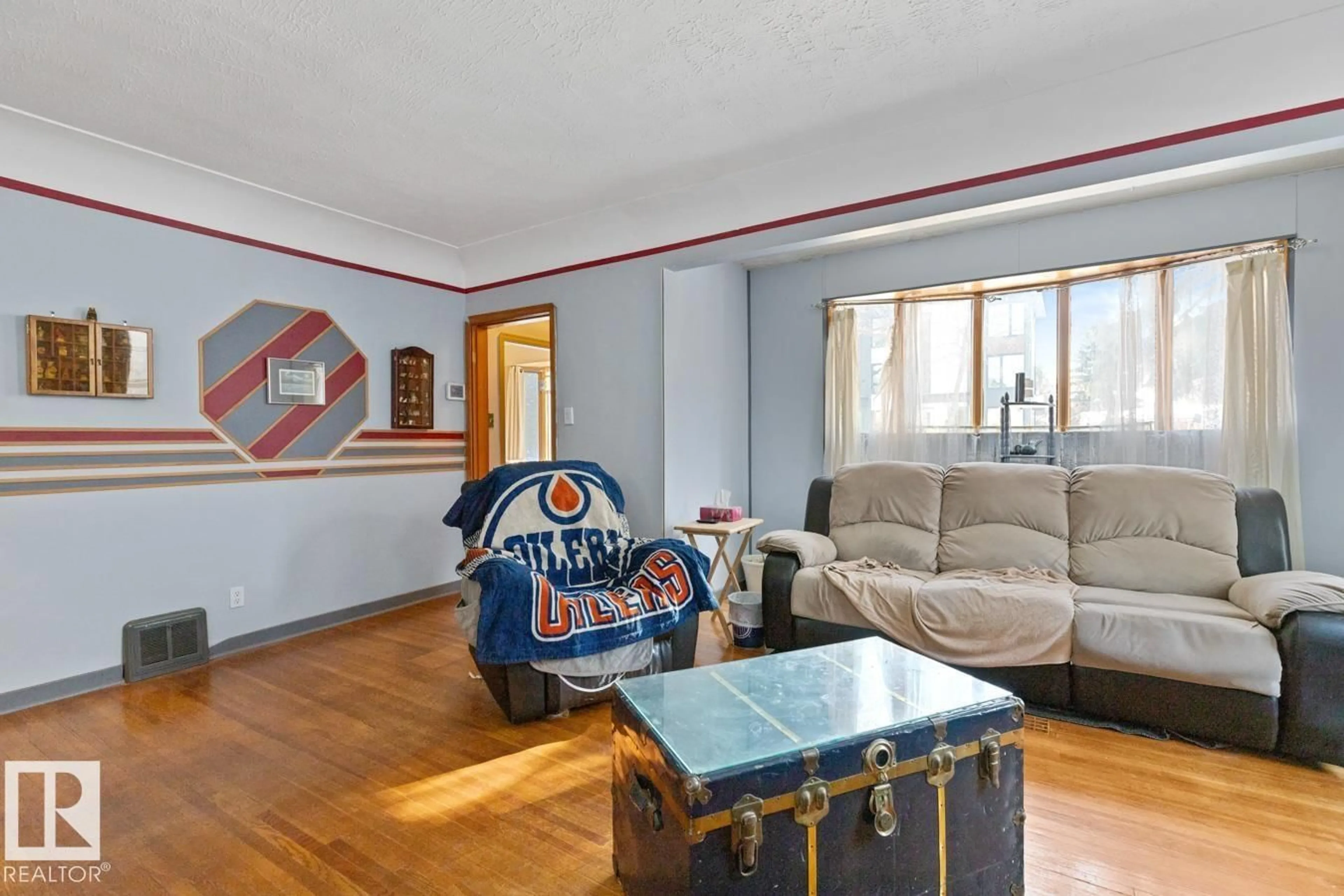 Living room with furniture, unknown for 8906 94 AV, Edmonton Alberta T6C1W7