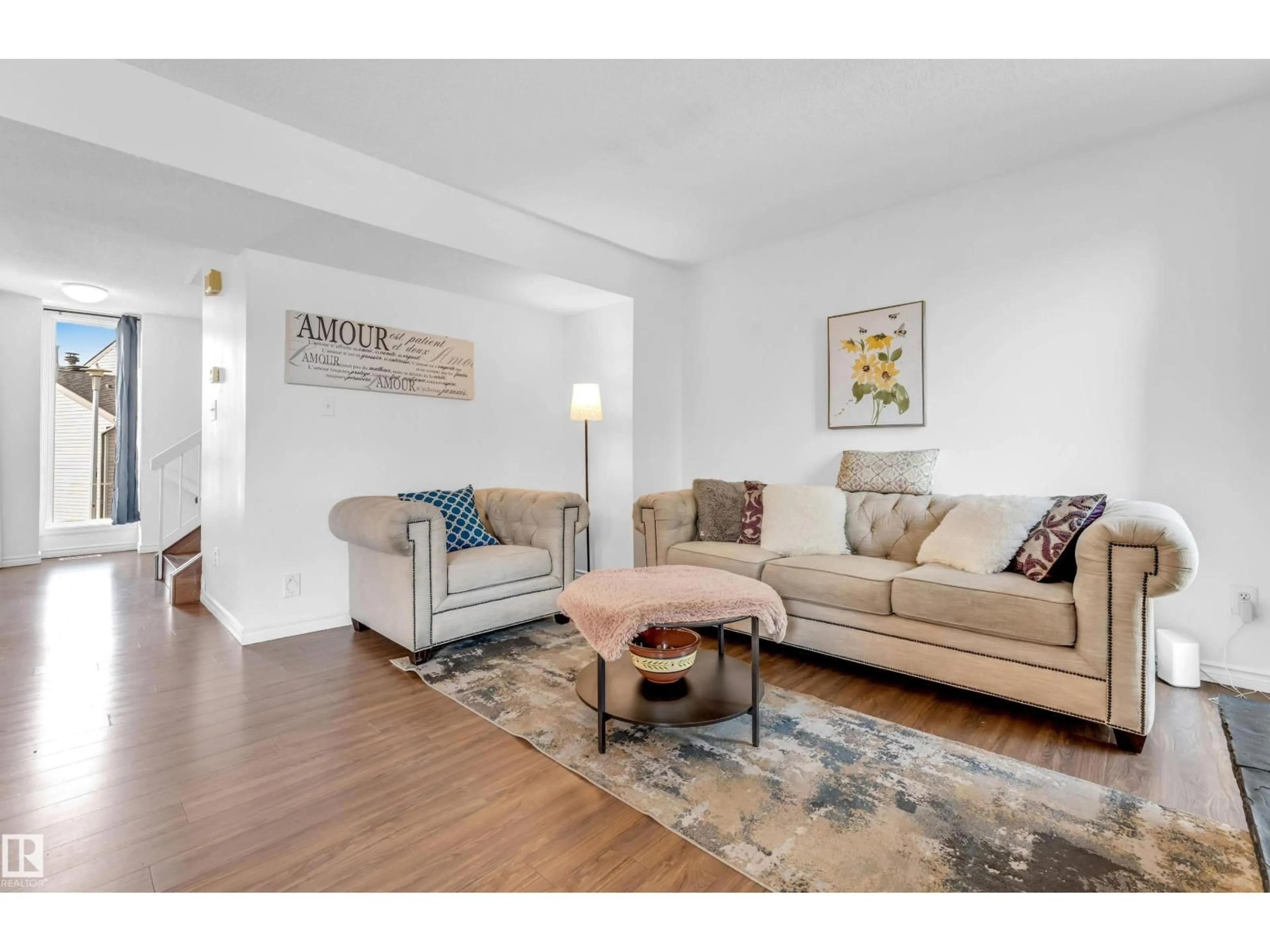 Living room with furniture, wood/laminate floor for 5344 38A AV, Edmonton Alberta T6L2H4