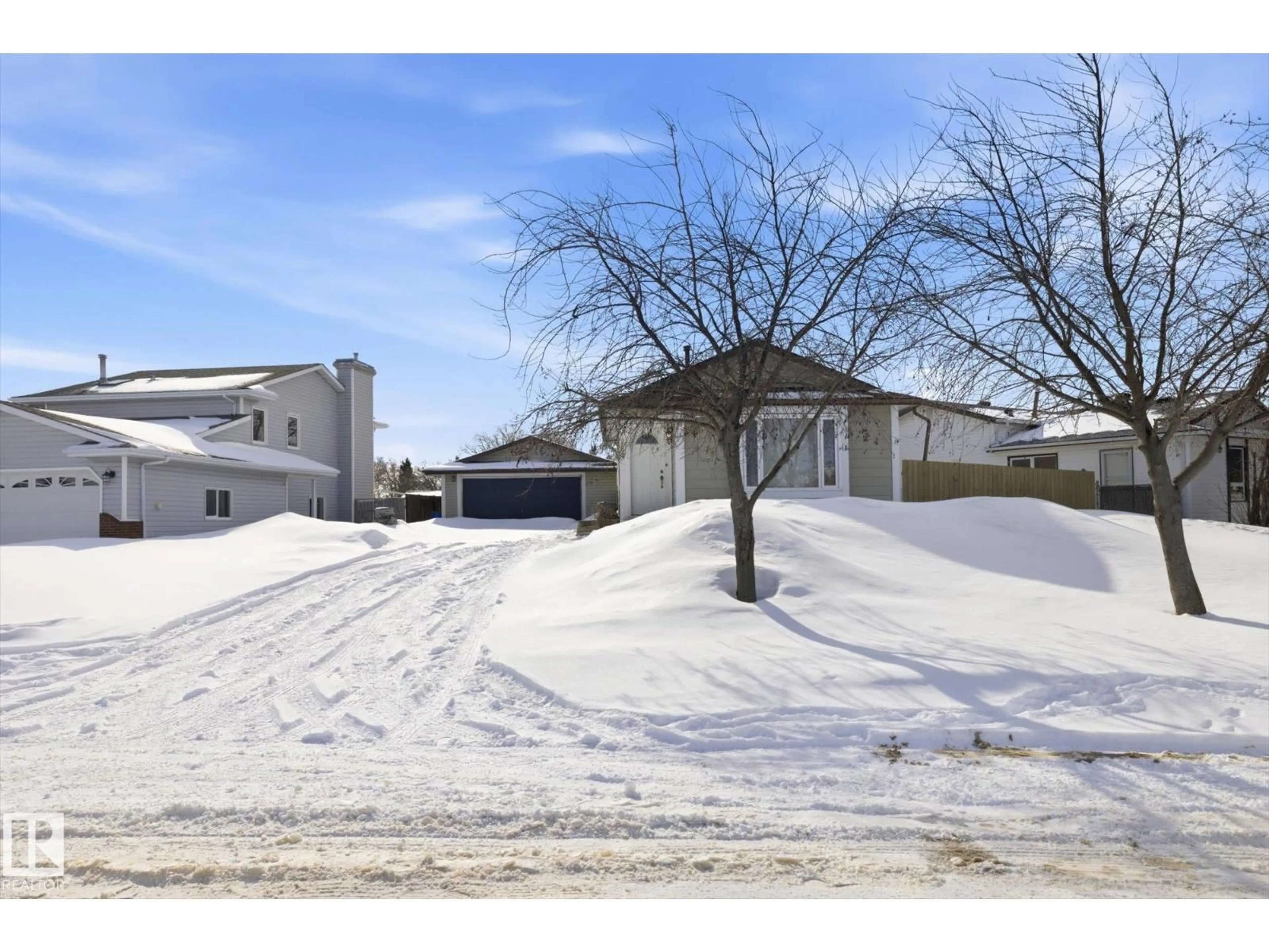 A pic from outside/outdoor area/front of a property/back of a property/a pic from drone, street for 9009 102 AV, Morinville Alberta T8R1B5