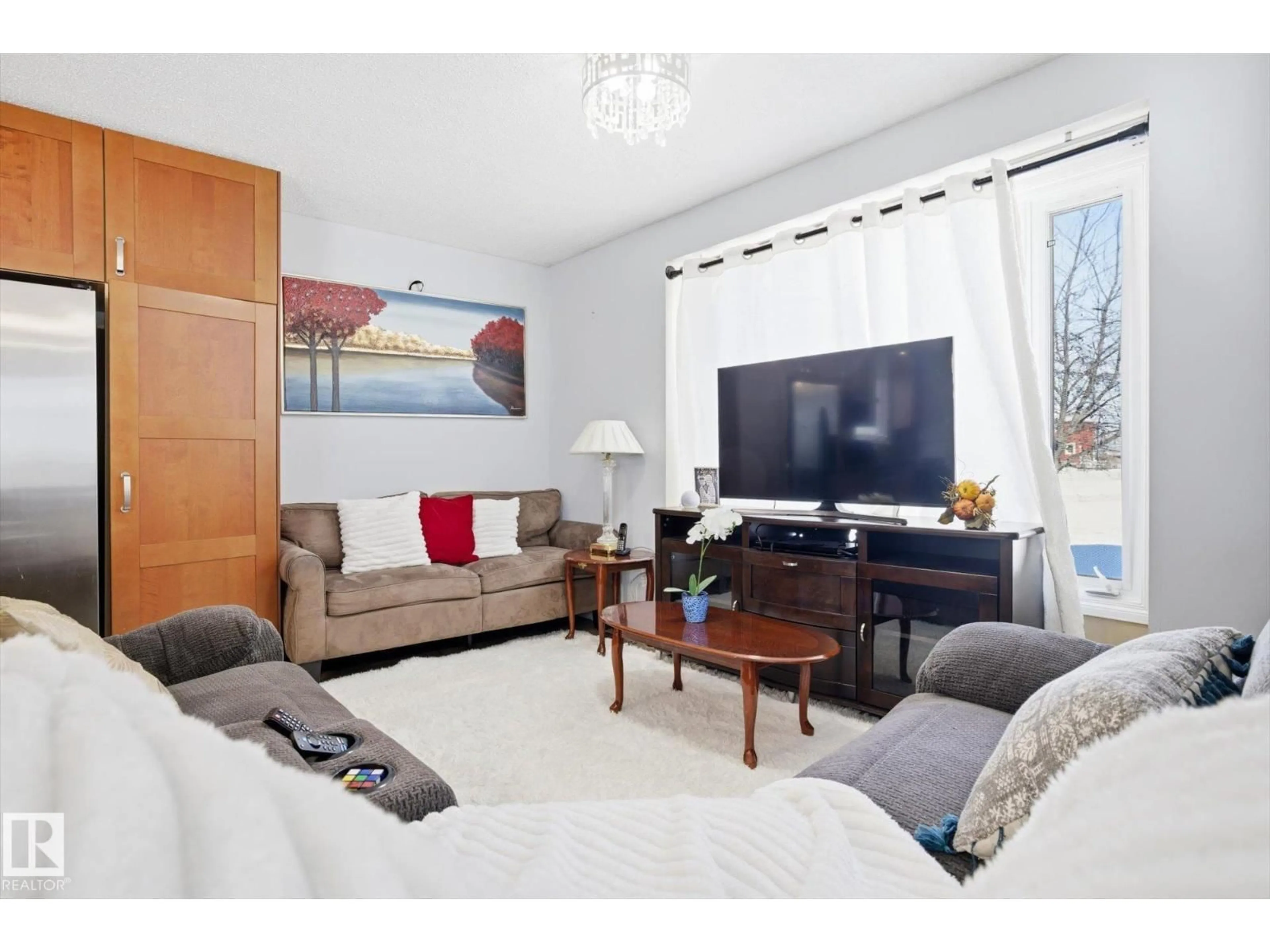 Living room with furniture, unknown for 9009 102 AV, Morinville Alberta T8R1B5