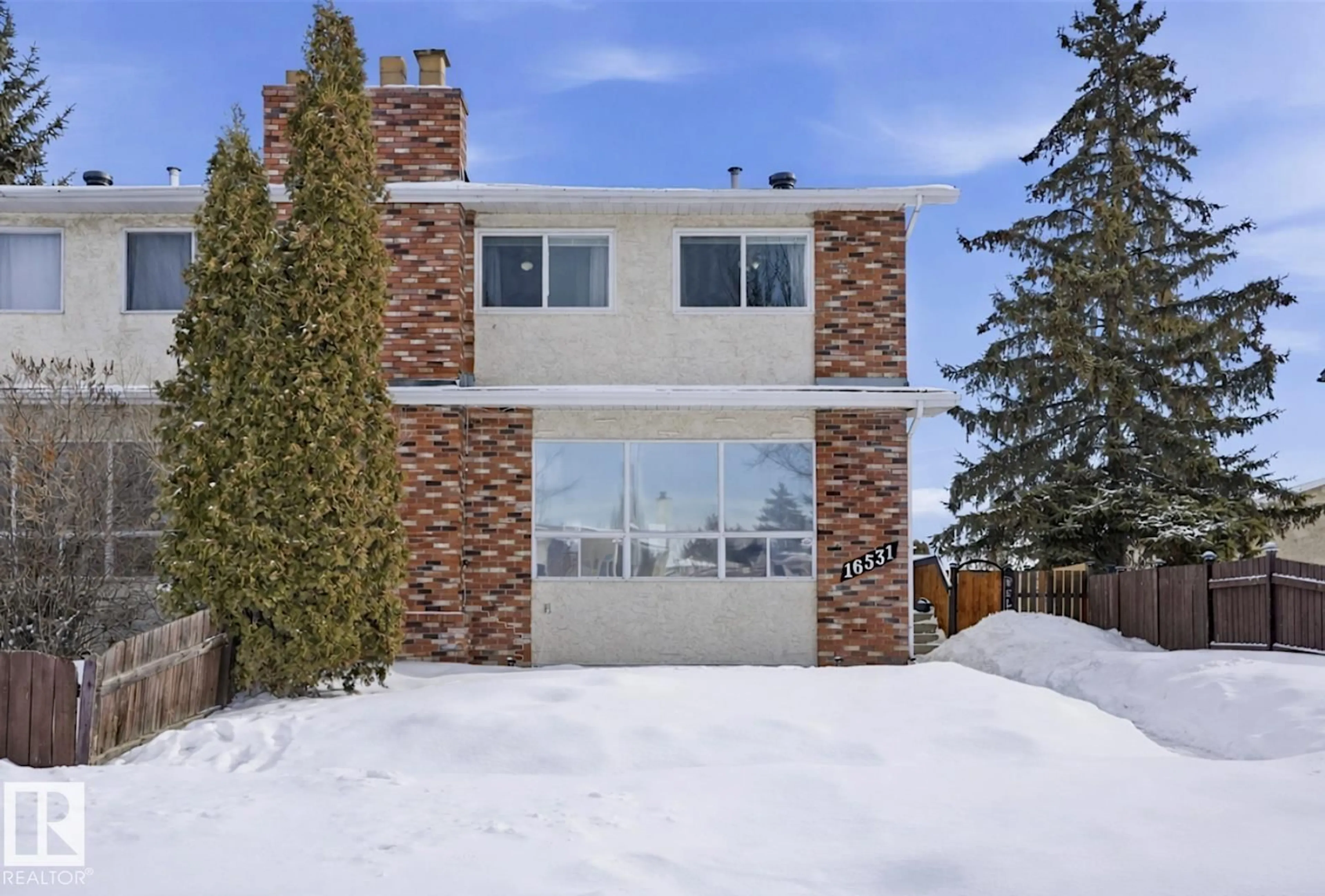 Home with brick exterior material, street for NW - 16531 115 ST, Edmonton Alberta T5X3V3
