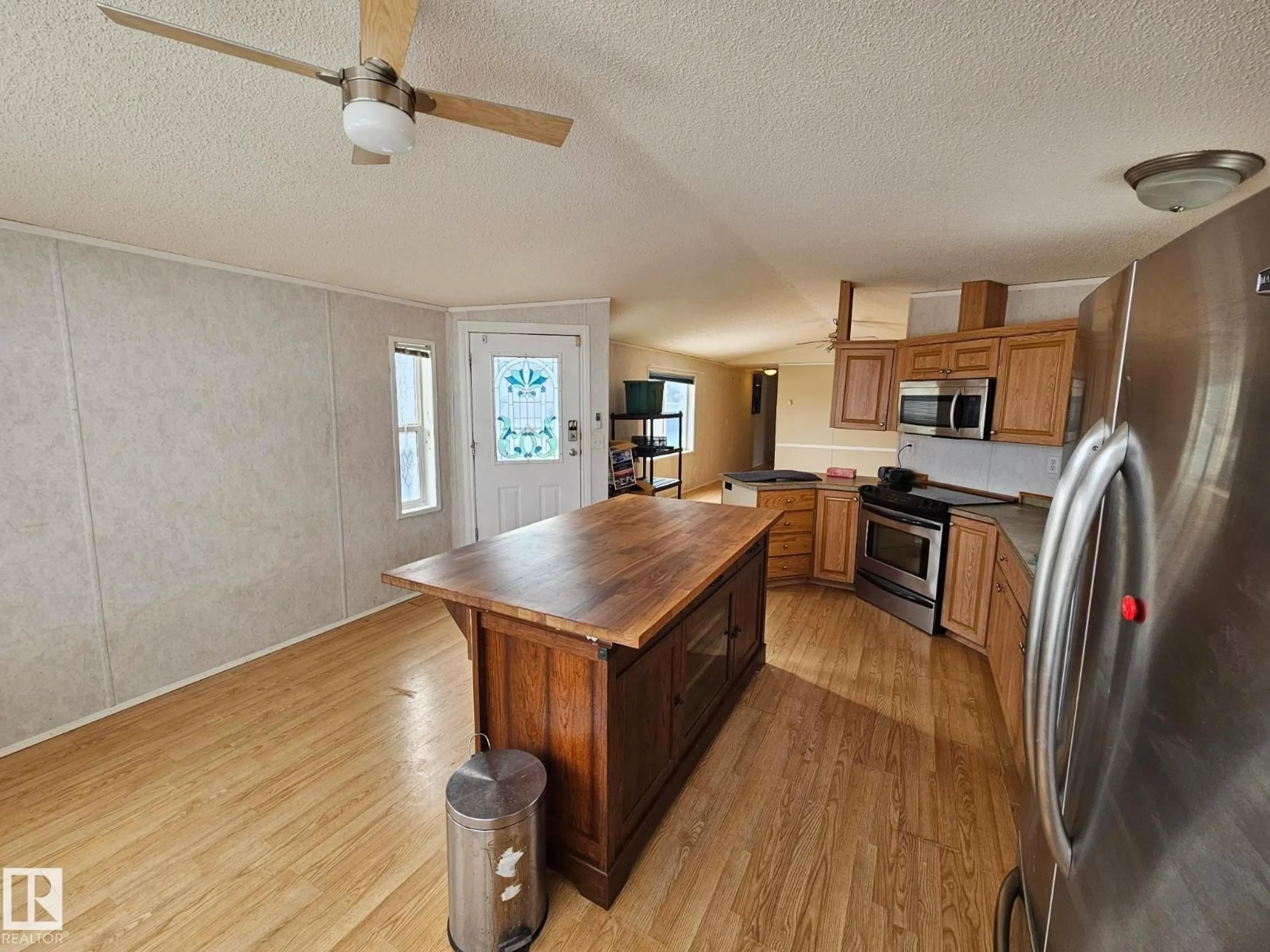 Open concept kitchen, wood/laminate floor for 106 OAKWOOD RD, Edmonton Alberta T6P0A2