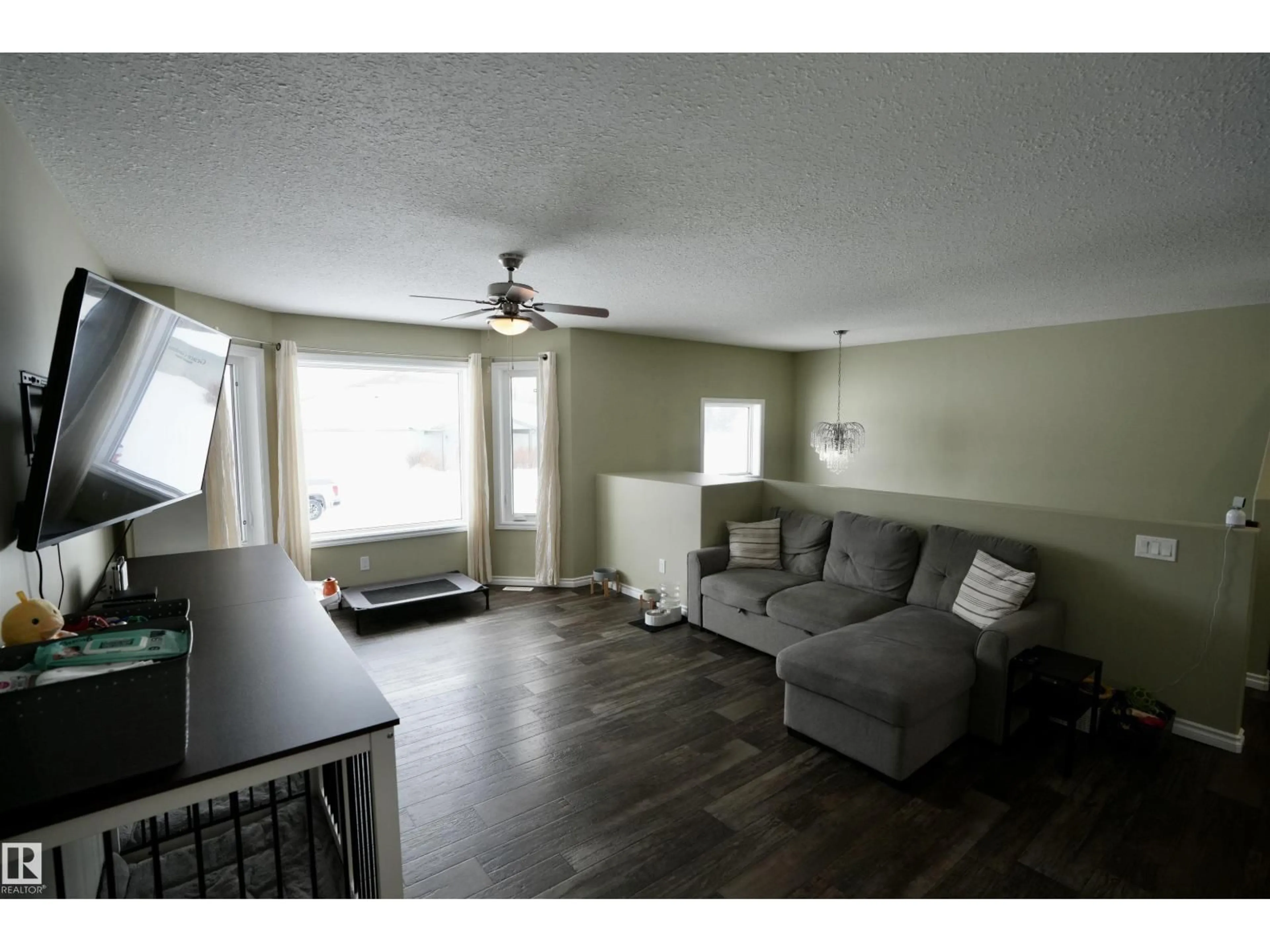 Living room with furniture, wood/laminate floor for 5113 56 AV, St. Paul Town Alberta T0A3A1