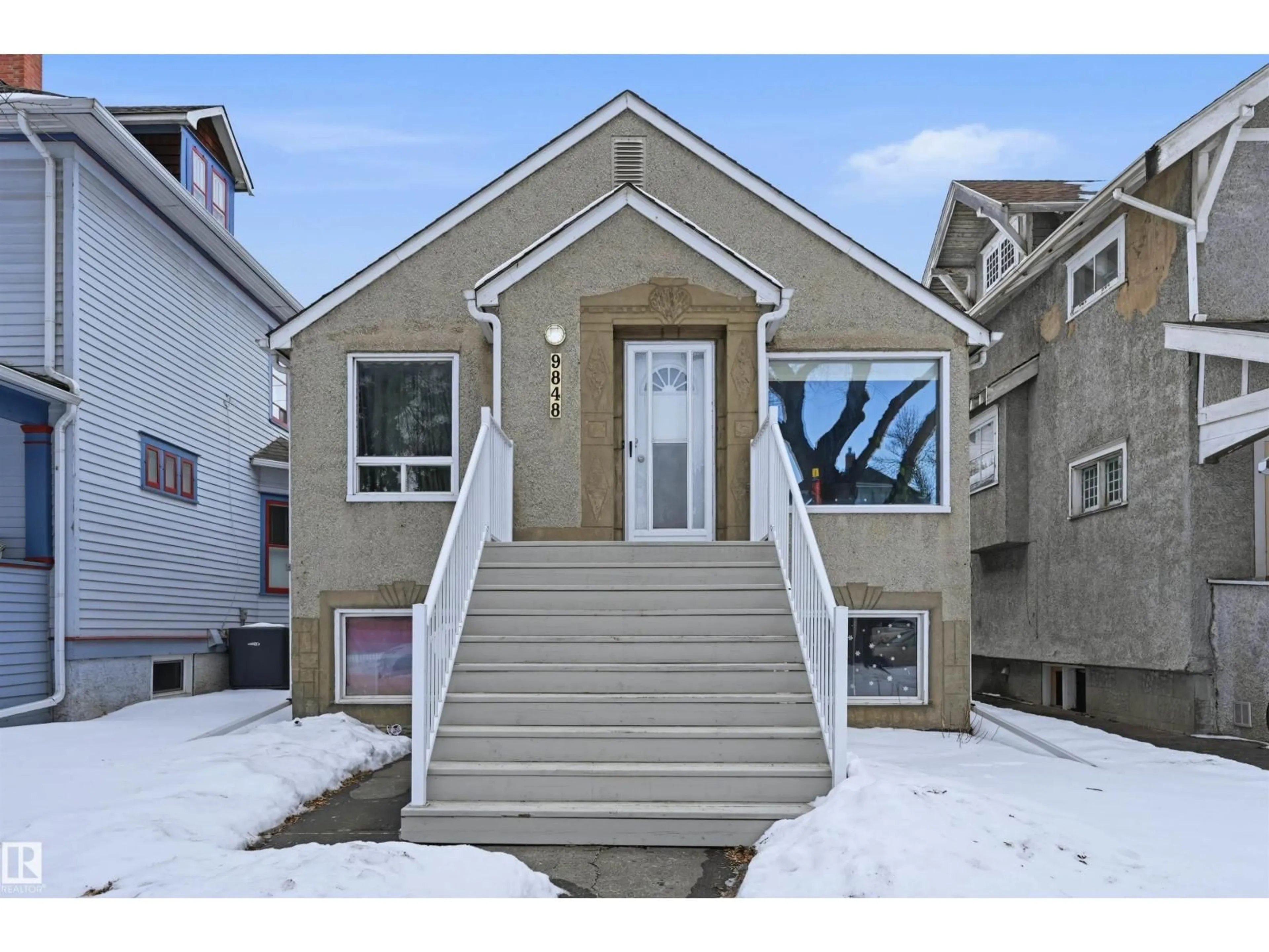 Home with vinyl exterior material, street for 9848 87 AV, Edmonton Alberta T6E2N6