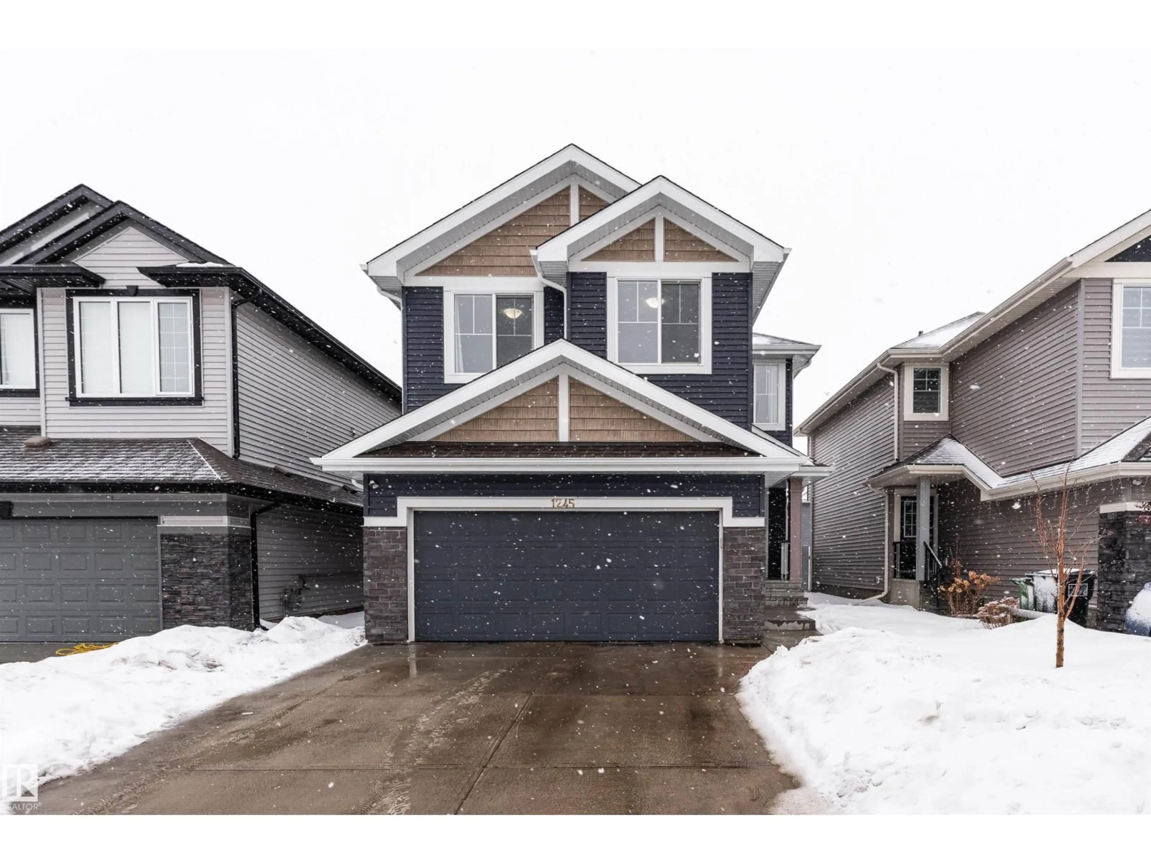 Home with vinyl exterior material, street for 1245 26A ST, Edmonton Alberta T6T2J4