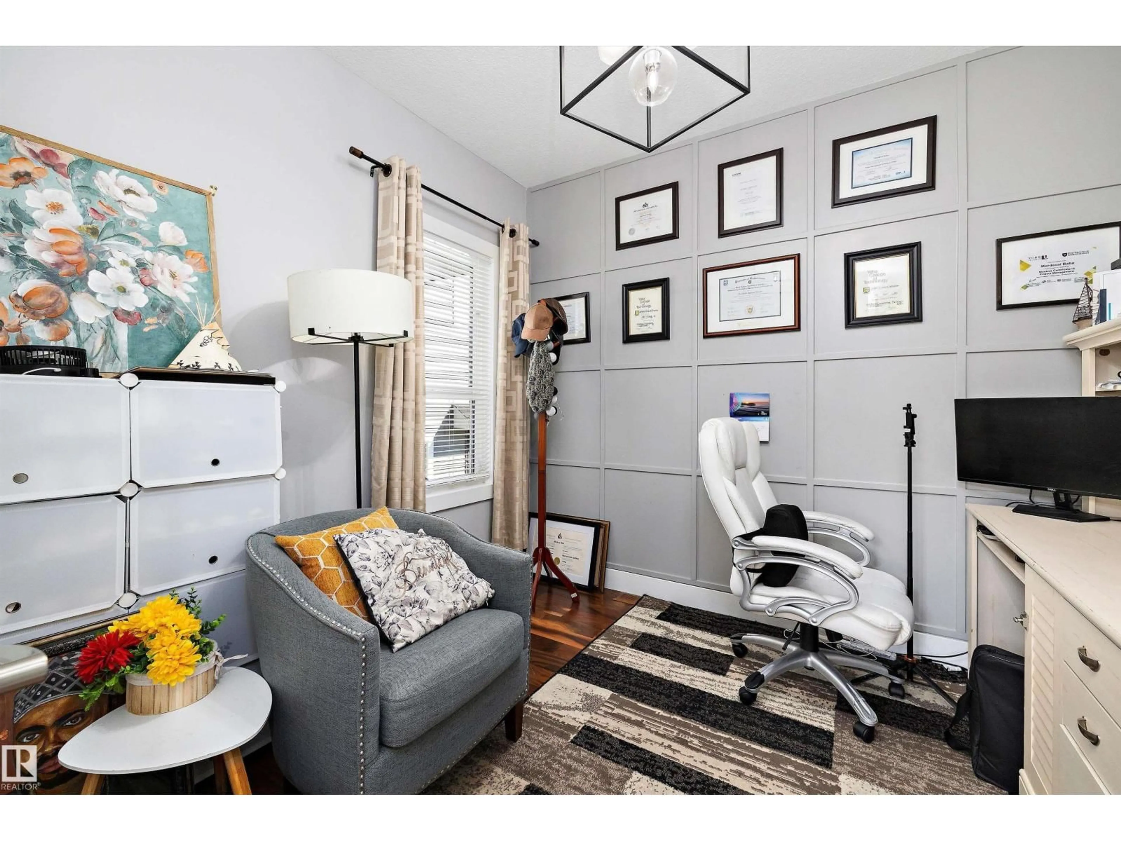 Living room with furniture, wood/laminate floor for 3380 CHICKADEE DR, Edmonton Alberta T5S0K9