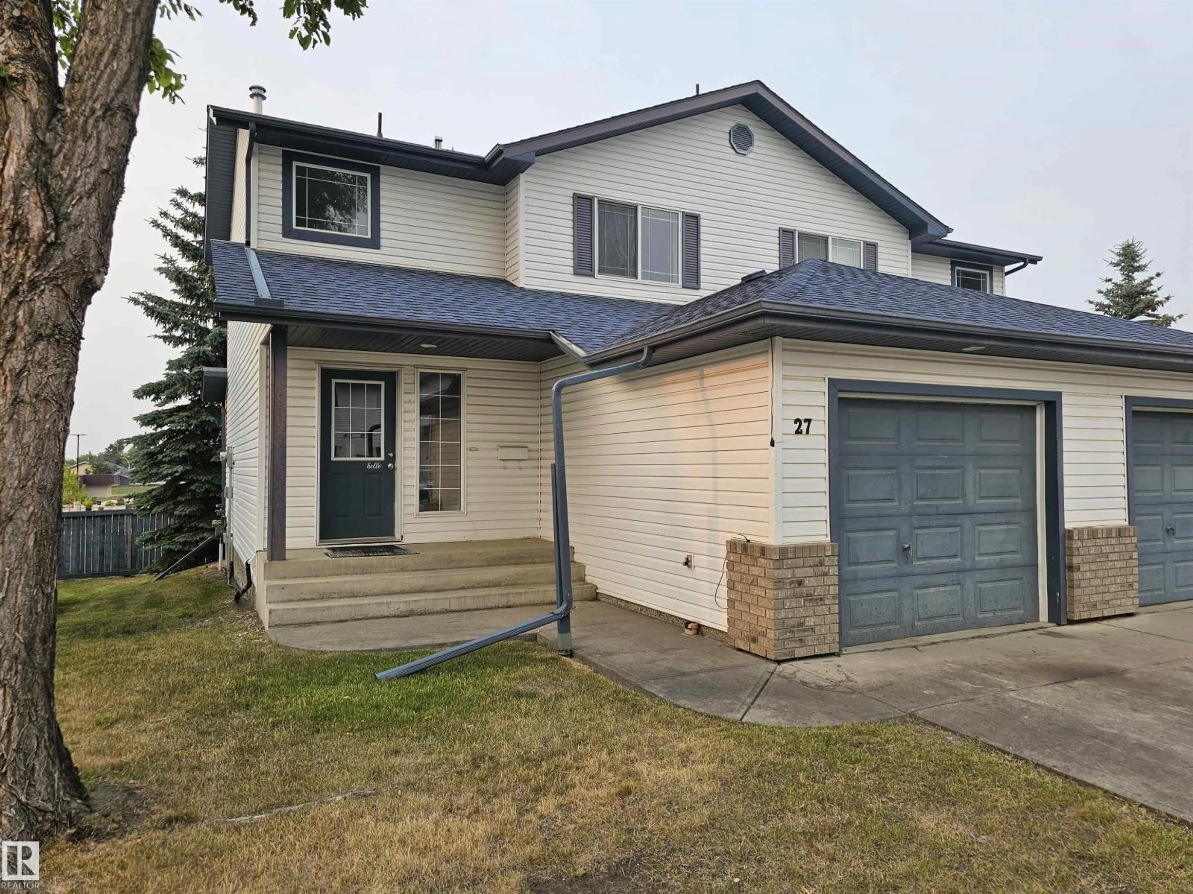 Home with vinyl exterior material, street for 27 GROVE MEADOW DR, Spruce Grove Alberta T7X4L9