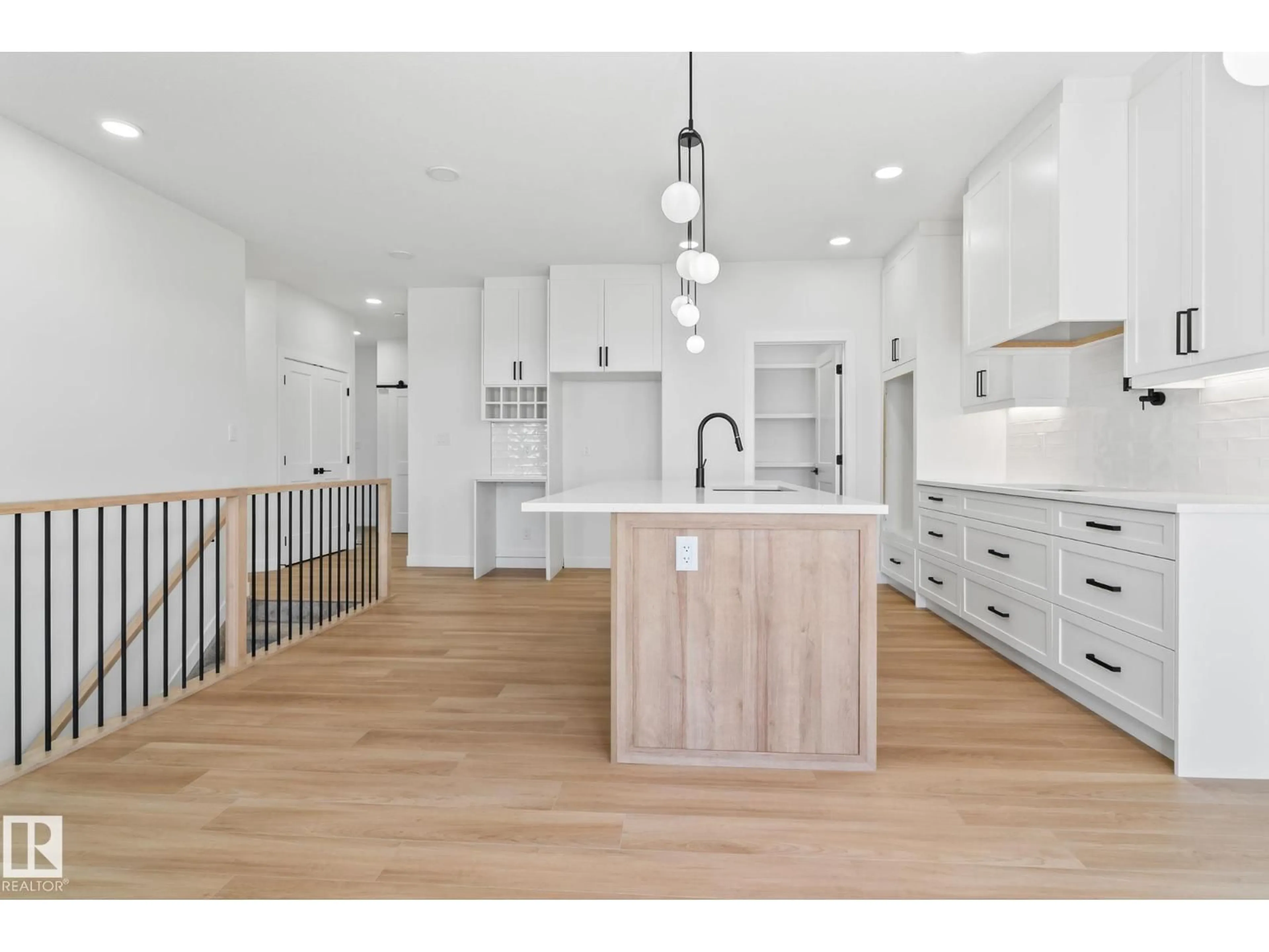 Open concept kitchen, wood/laminate floor for 1411 REDPOLL COURT, Edmonton Alberta T5S0V4