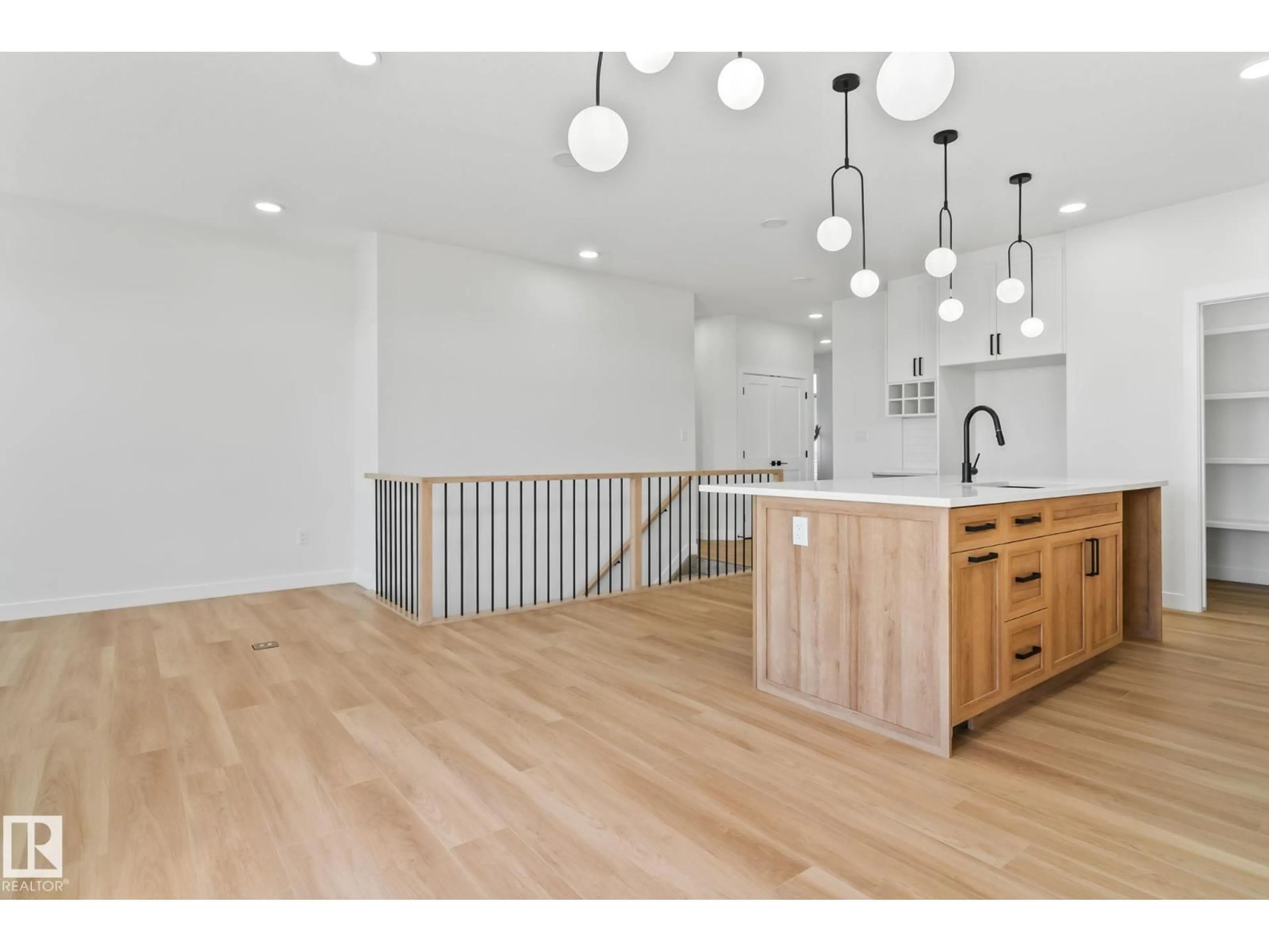 Open concept kitchen, wood/laminate floor for 1411 REDPOLL COURT, Edmonton Alberta T5S0V4