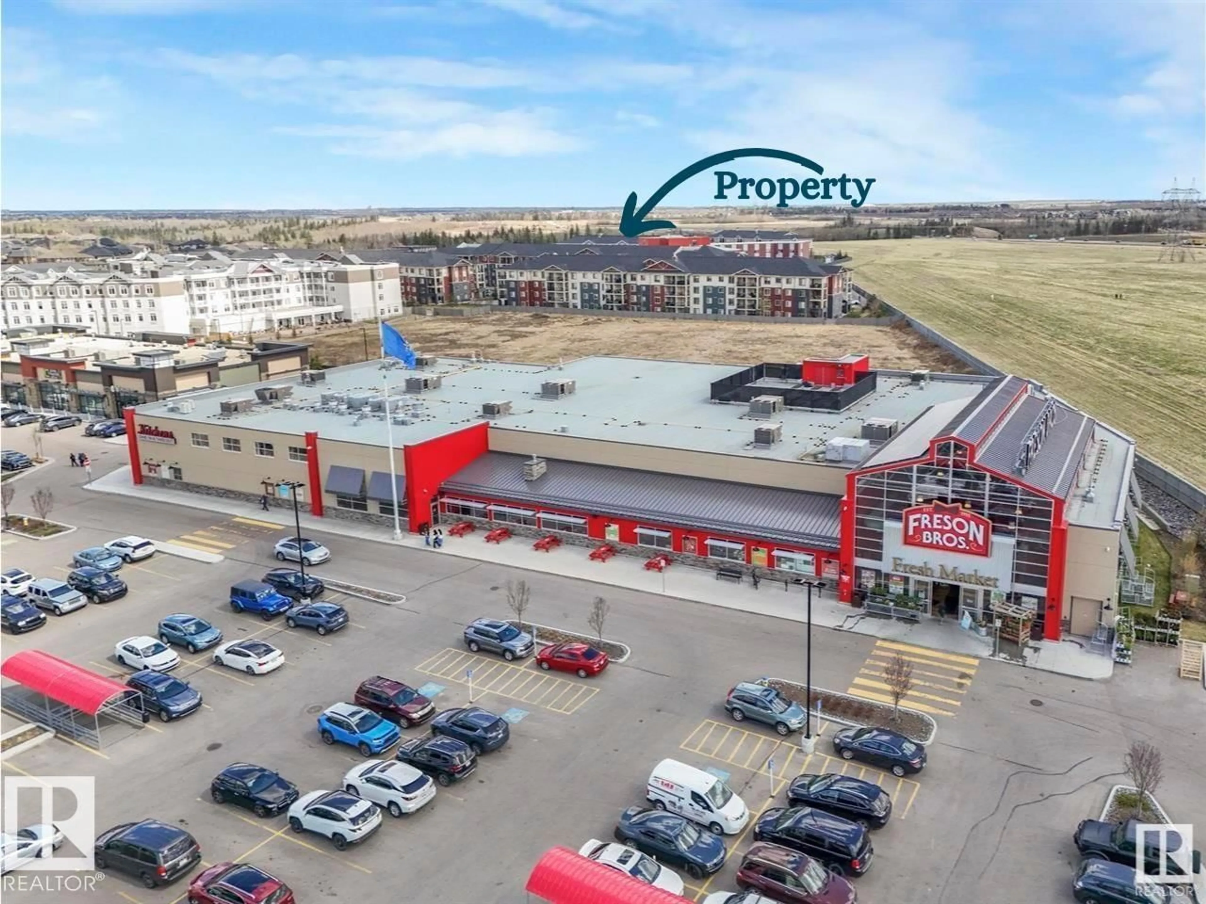 A pic from outside/outdoor area/front of a property/back of a property/a pic from drone, building for #422 - 5816 MULLEN PL, Edmonton Alberta T6R0W3