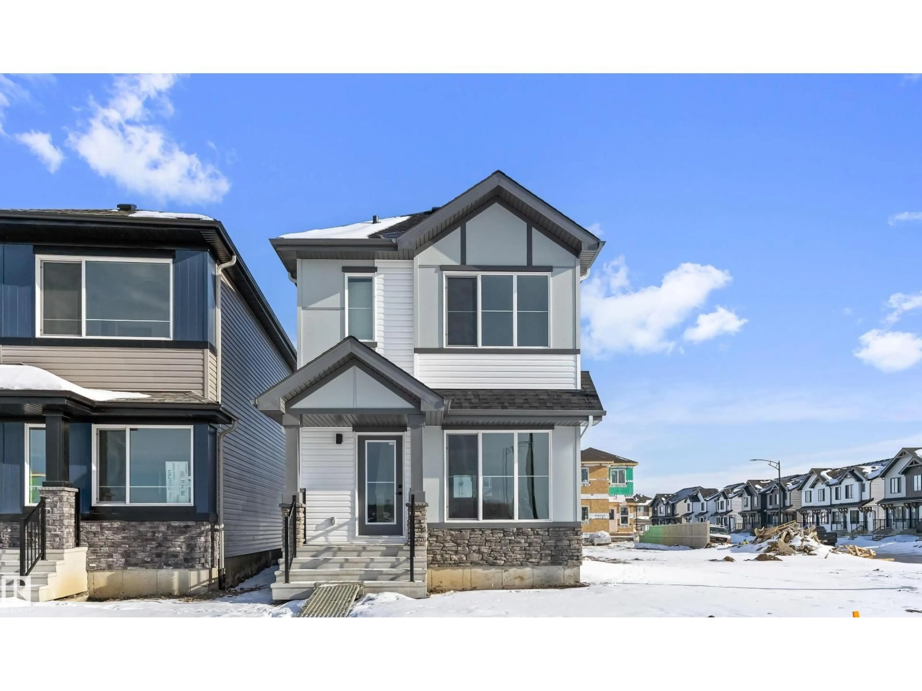 Home with vinyl exterior material, street for 1008 14 AV, Edmonton Alberta T6T2W7