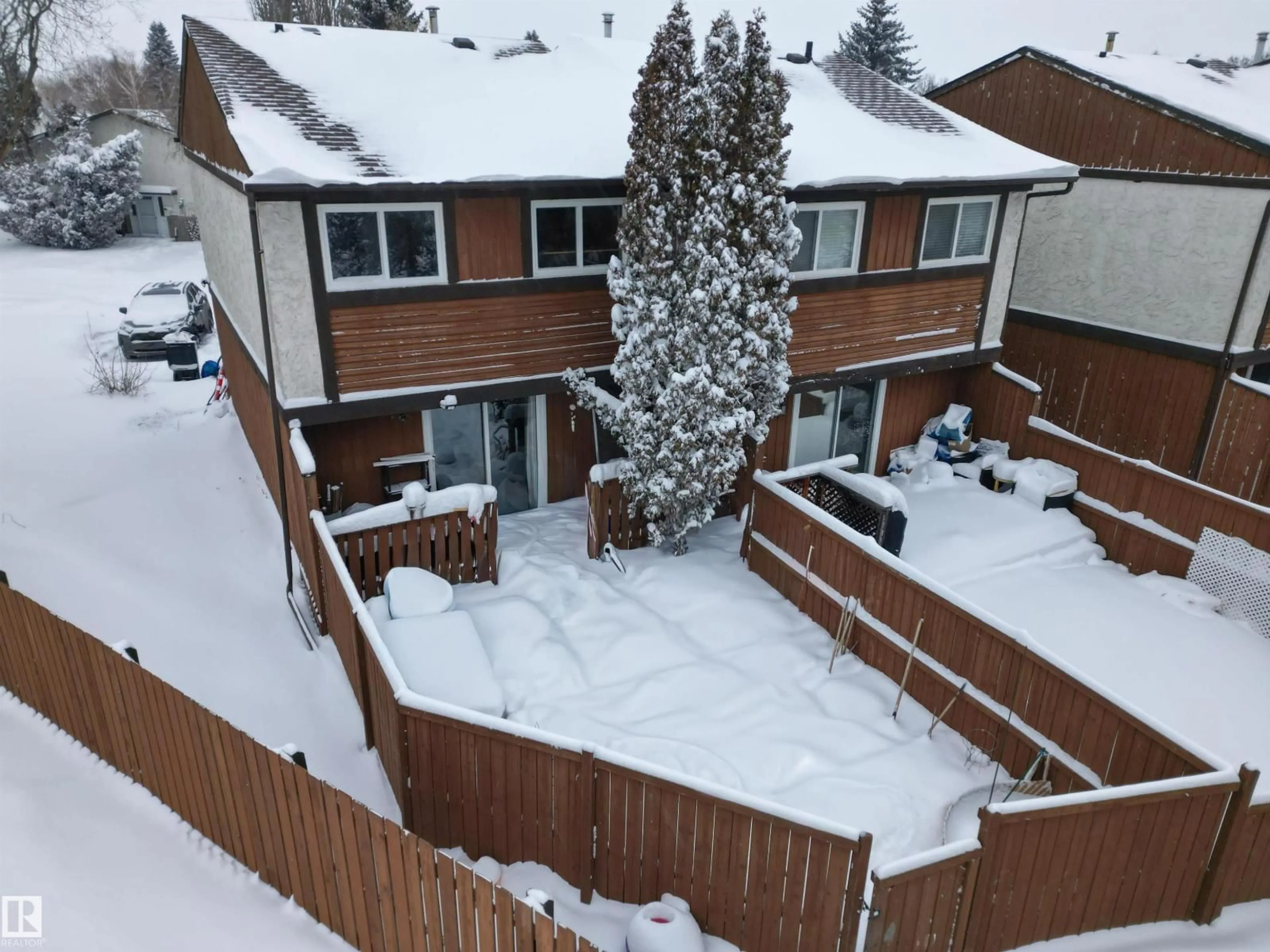 A pic from outside/outdoor area/front of a property/back of a property/a pic from drone, mountain view for #101 - 16725 106 ST, Edmonton Alberta T5X5G5