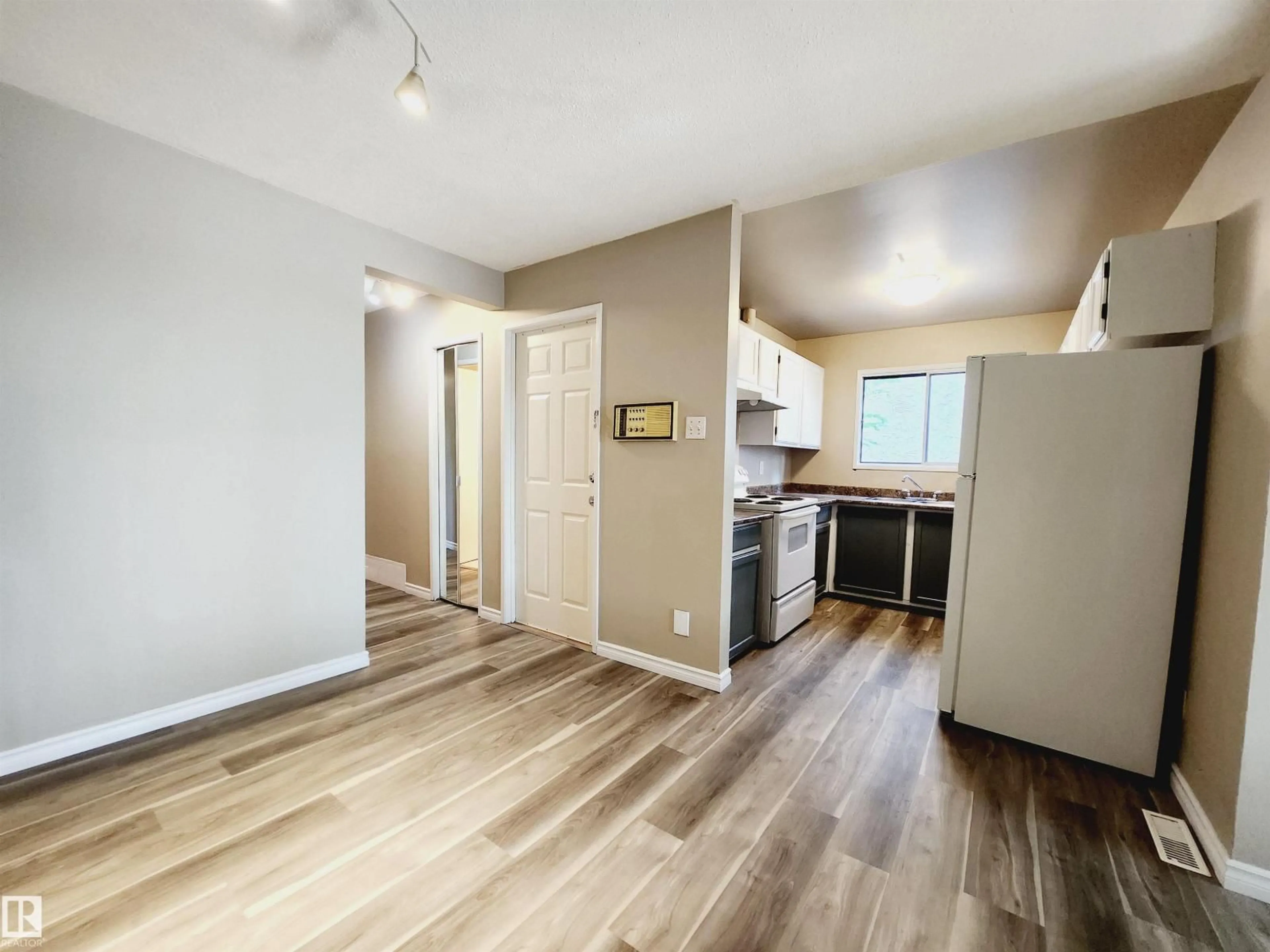 Open concept kitchen, wood/laminate floor for NW - 12212-12214 77 ST, Edmonton Alberta T5B2G9