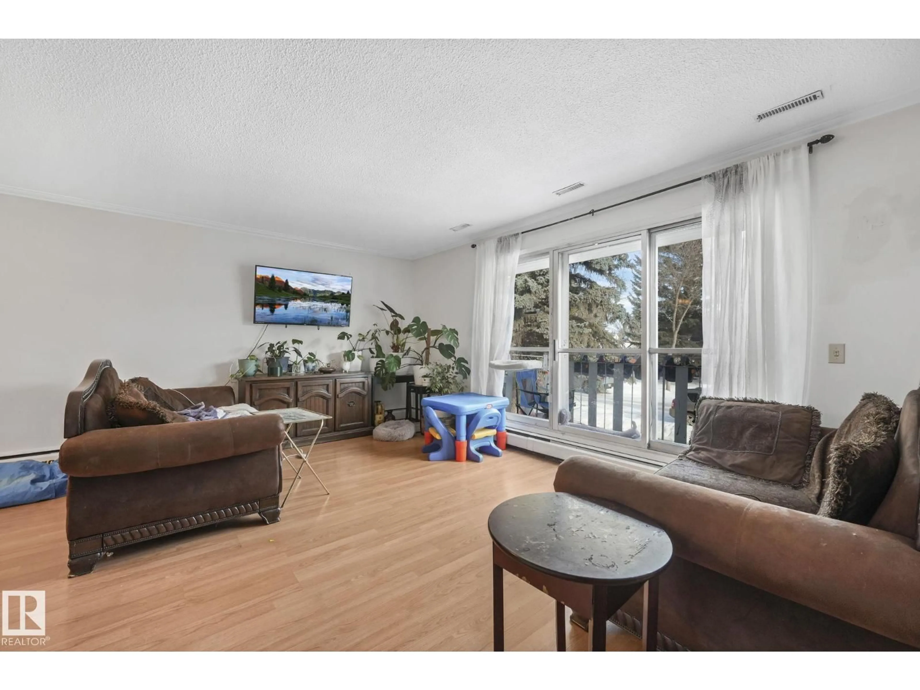 Living room with furniture, wood/laminate floor for NW - 10418-20 147 ST, Edmonton Alberta T5N3C5