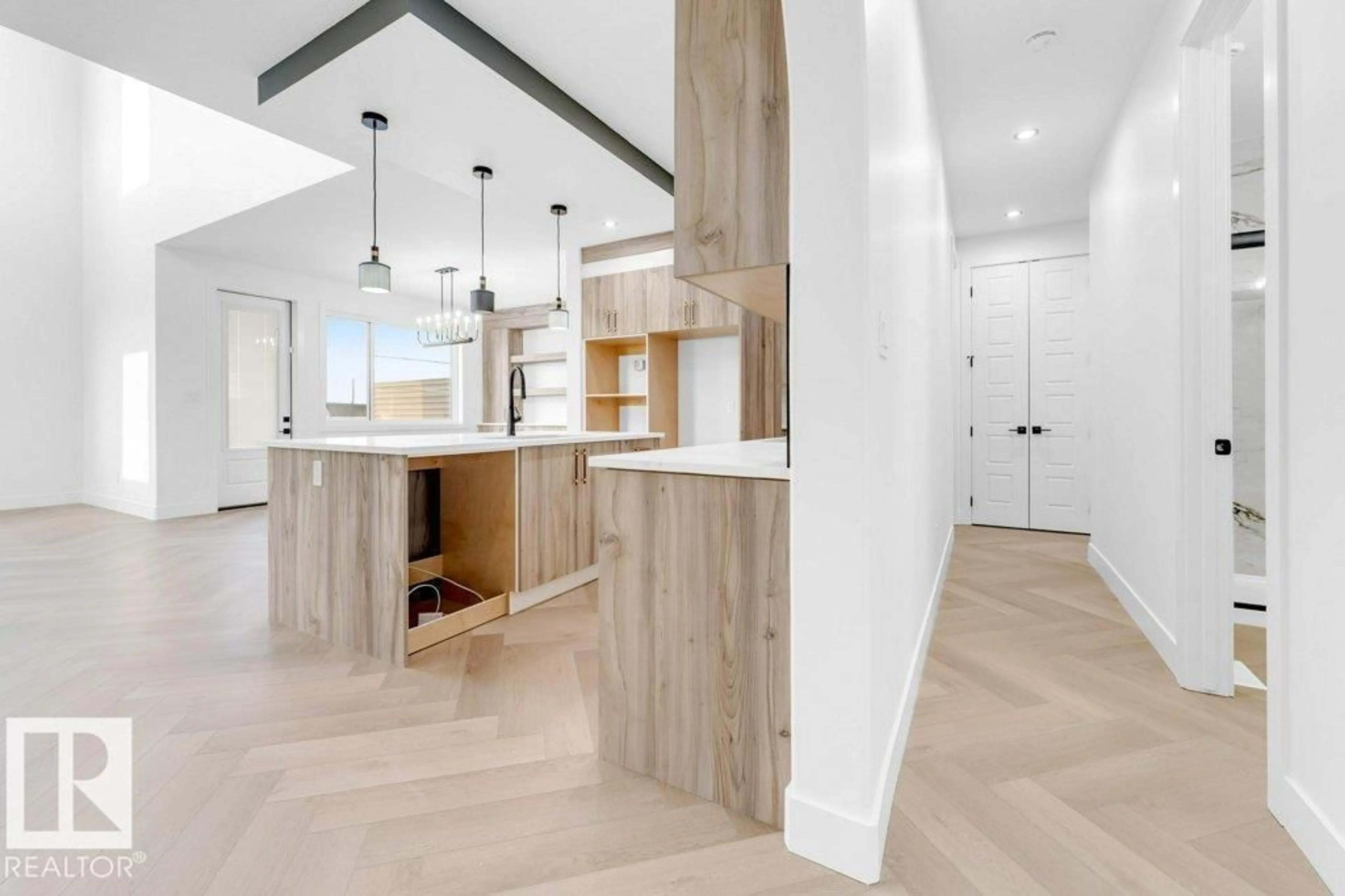 Open concept kitchen, wood/laminate floor for 16840 33 AV, Edmonton Alberta T6W5M3