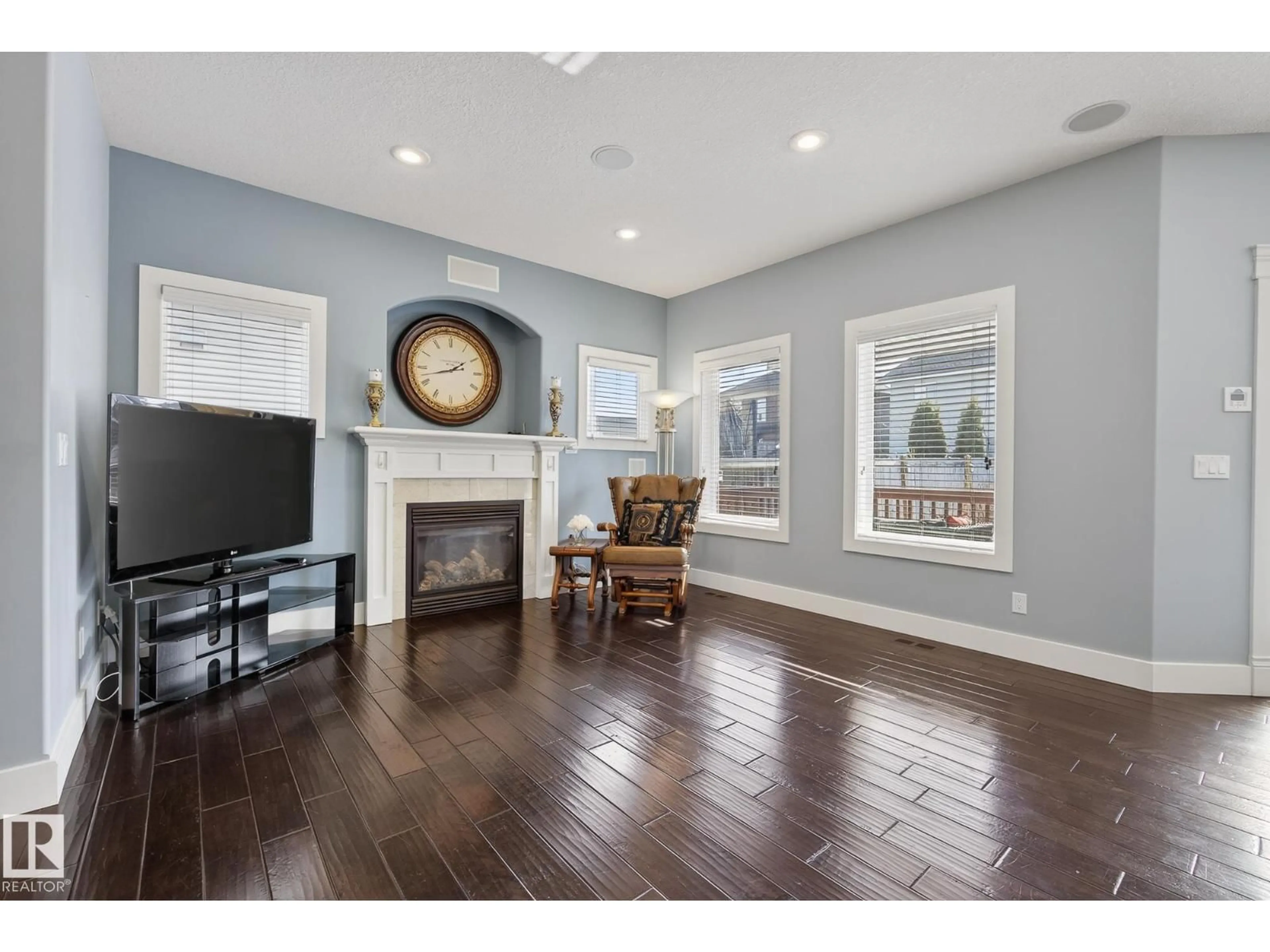 Living room with furniture, wood/laminate floor for 1519 CHAPMAN WY, Edmonton Alberta T6W0C9