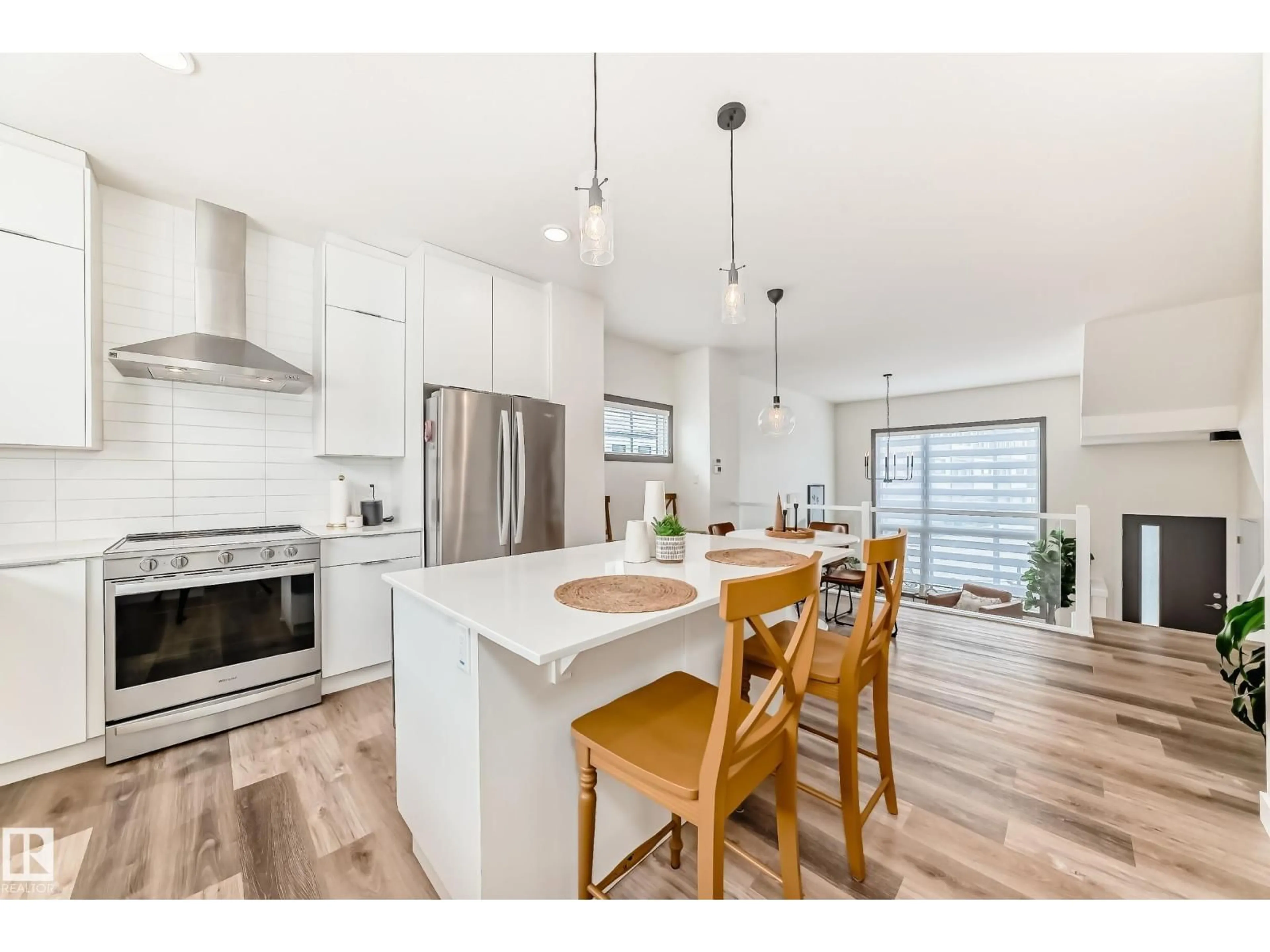 Open concept kitchen, wood/laminate floor for #102 - 50 EBONY BV, Sherwood Park Alberta T8H1X8