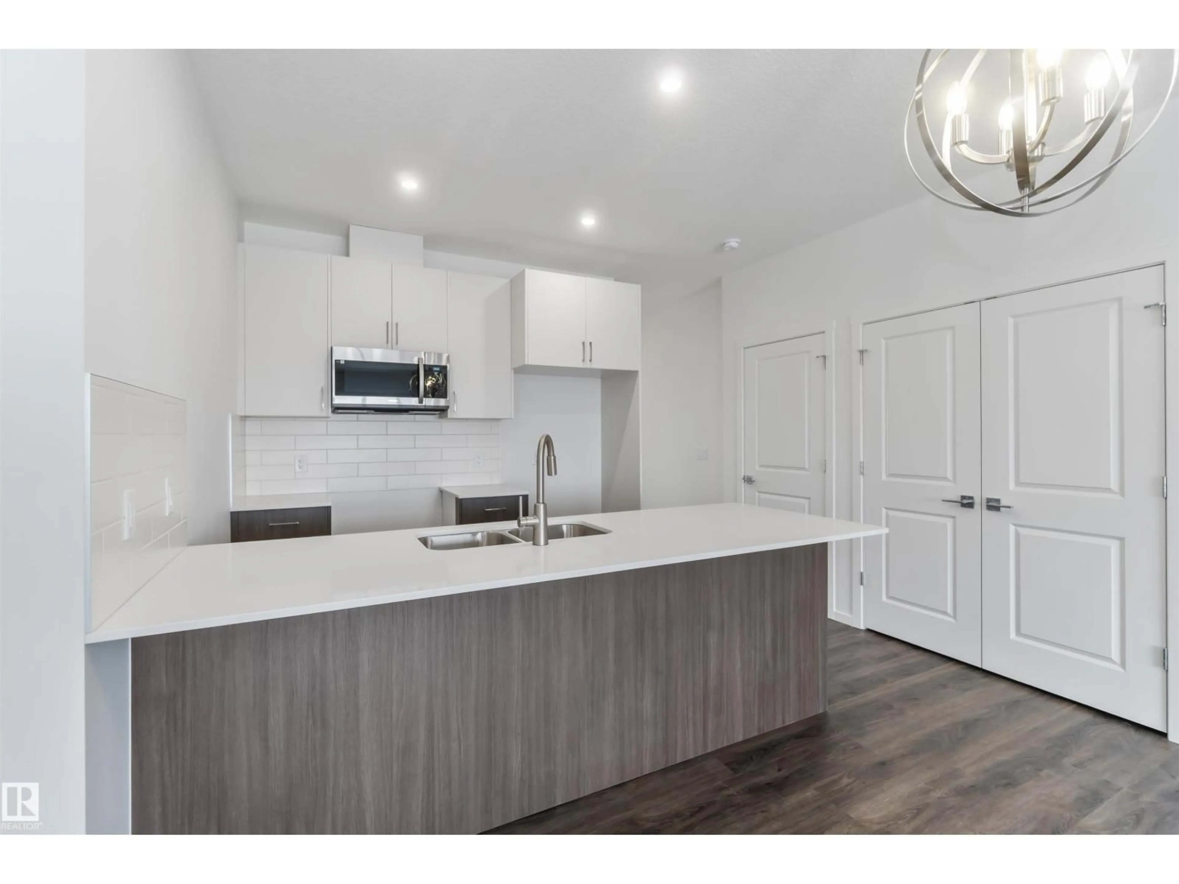 Open concept kitchen, wood/laminate floor for NW - 2467 ALCES LINK LI, Edmonton Alberta T6M3B1