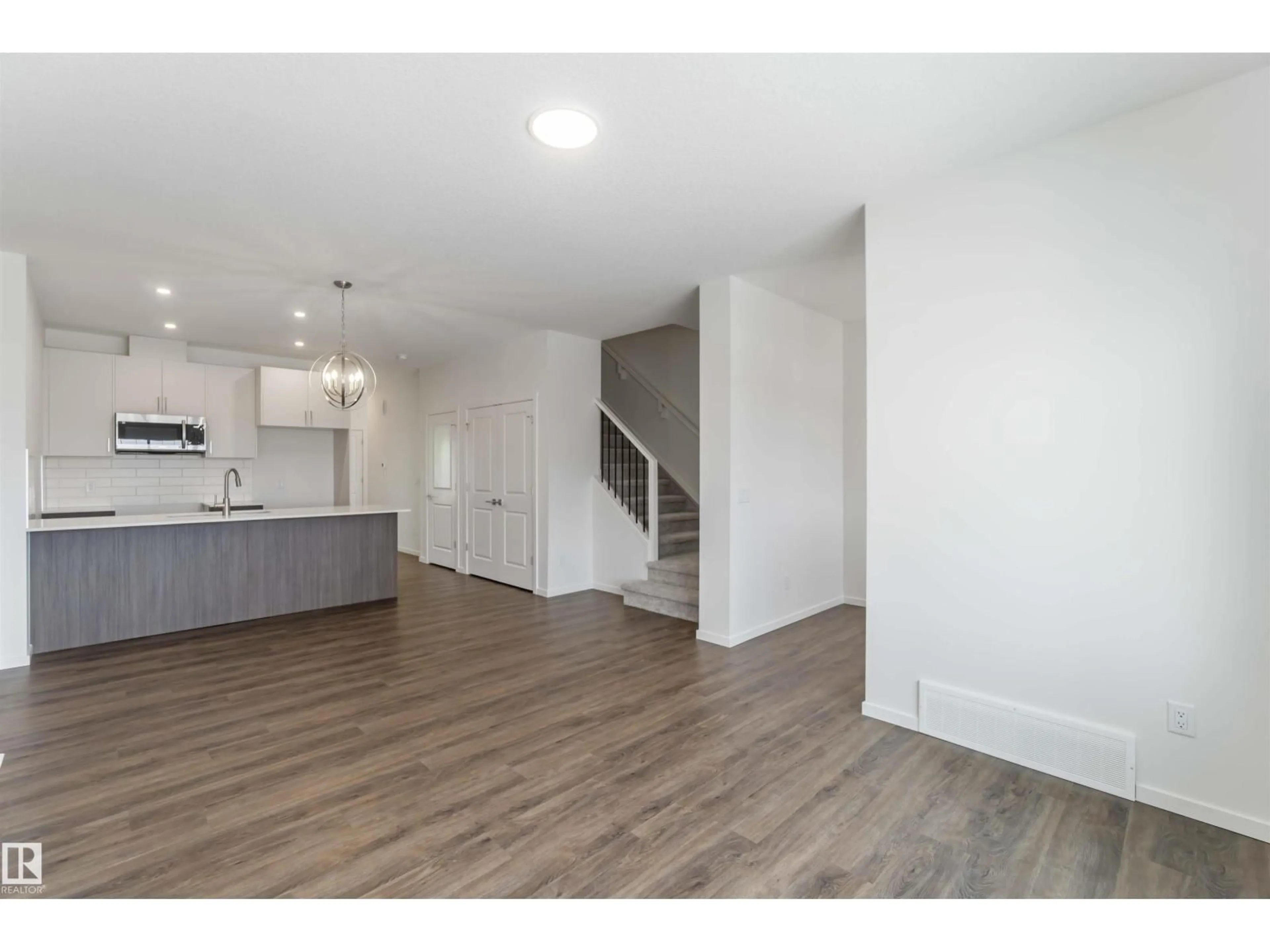 Open concept kitchen, wood/laminate floor for NW - 2467 ALCES LINK LI, Edmonton Alberta T6M3B1