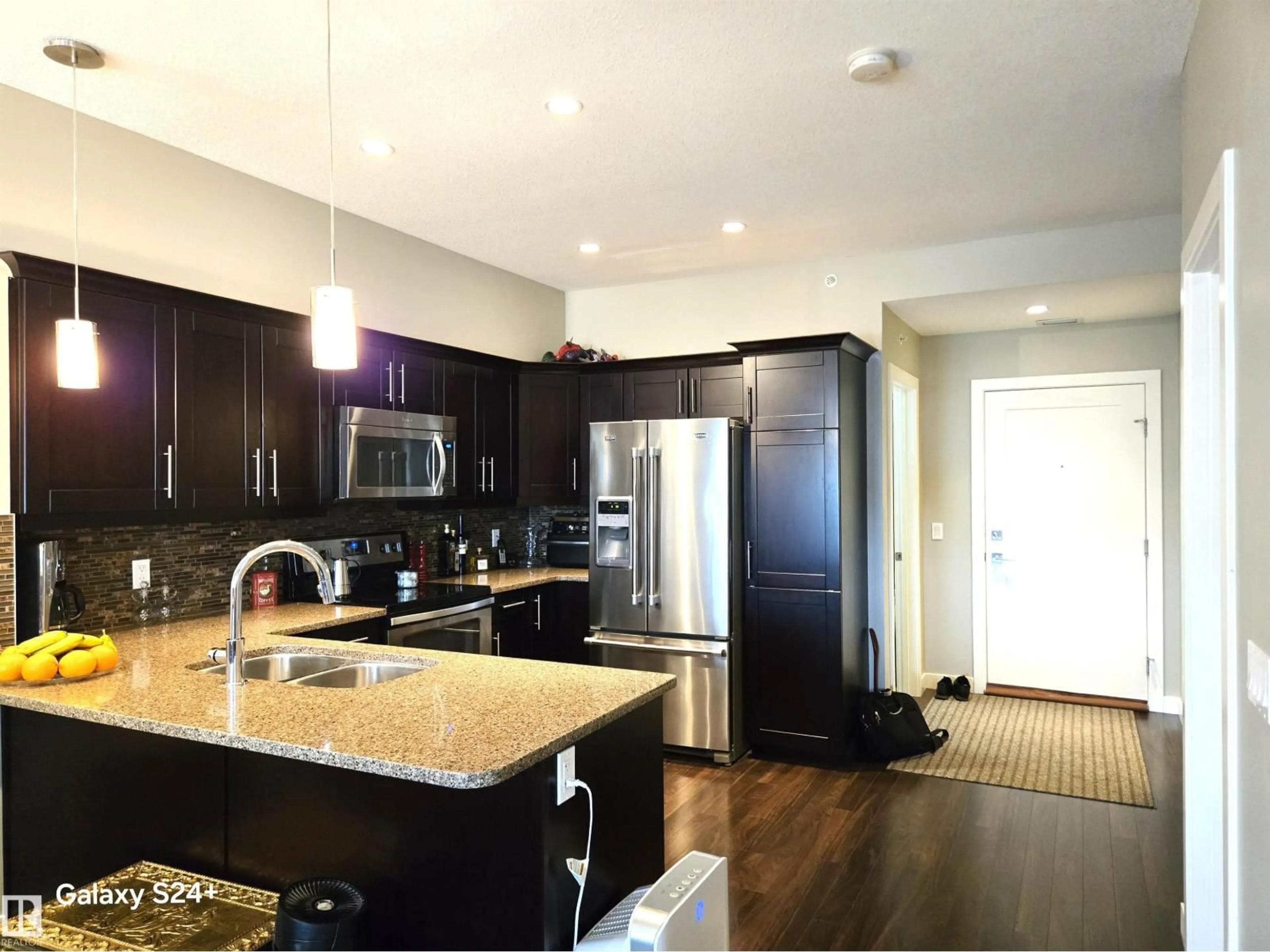 Open concept kitchen, unknown for #407 - 1031 173 ST, Edmonton Alberta T6W3E4