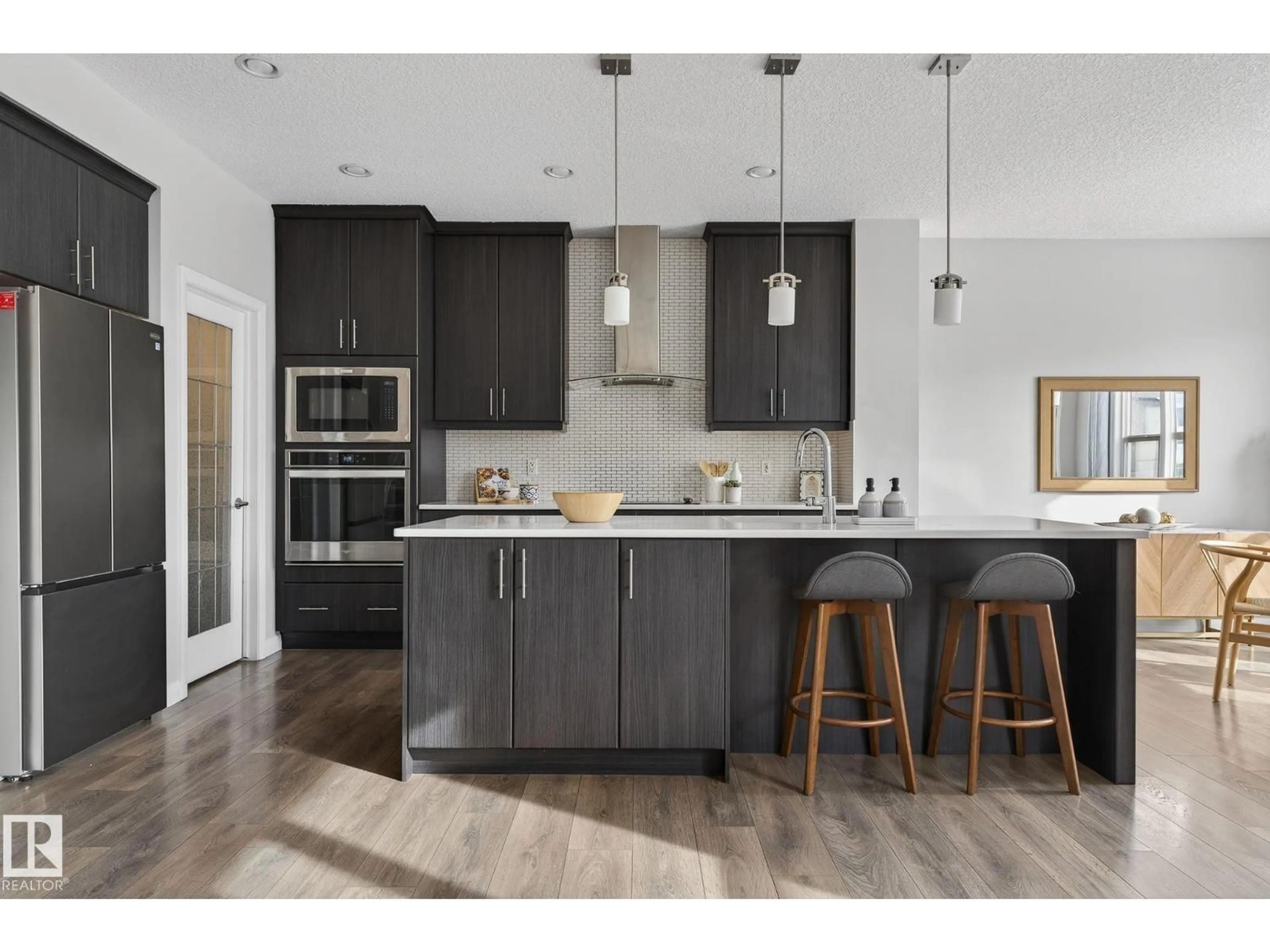 Open concept kitchen, wood/laminate floor for 22921 94A AV, Edmonton Alberta T5N7B3