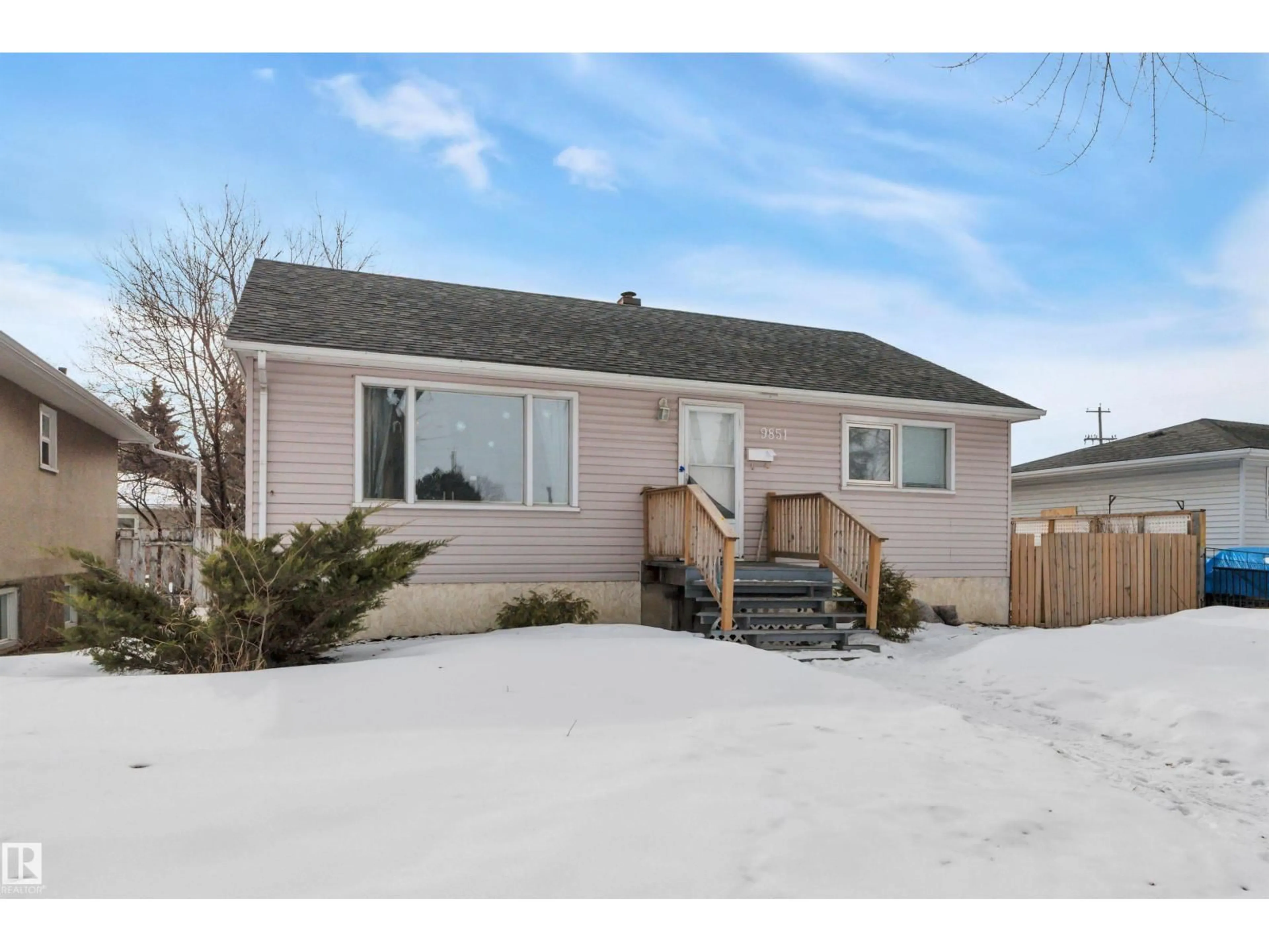 Home with vinyl exterior material, street for 9851 67 AV, Edmonton Alberta T6E0P3