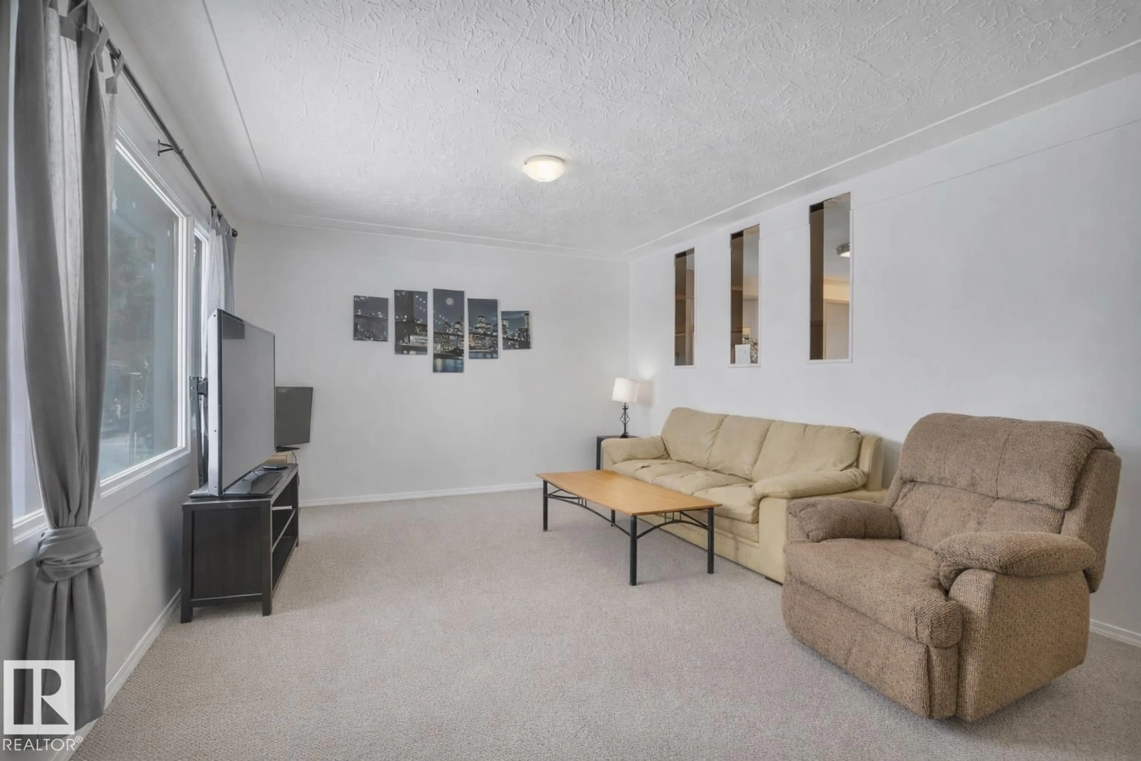 Living room with furniture, unknown for 9851 67 AV, Edmonton Alberta T6E0P3