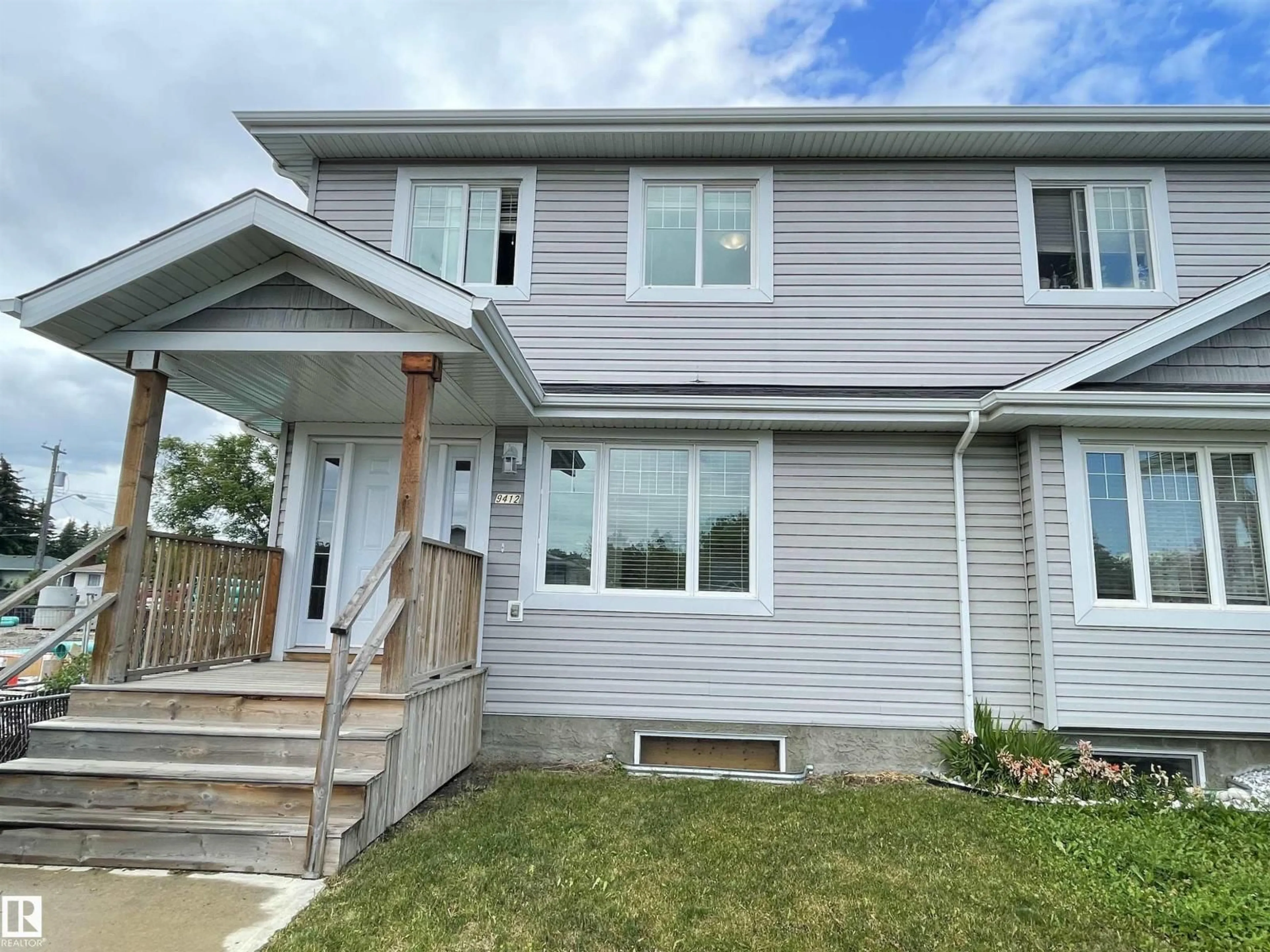 Home with vinyl exterior material, street for NW - 9412 156 ST, Edmonton Alberta T5R1Z4