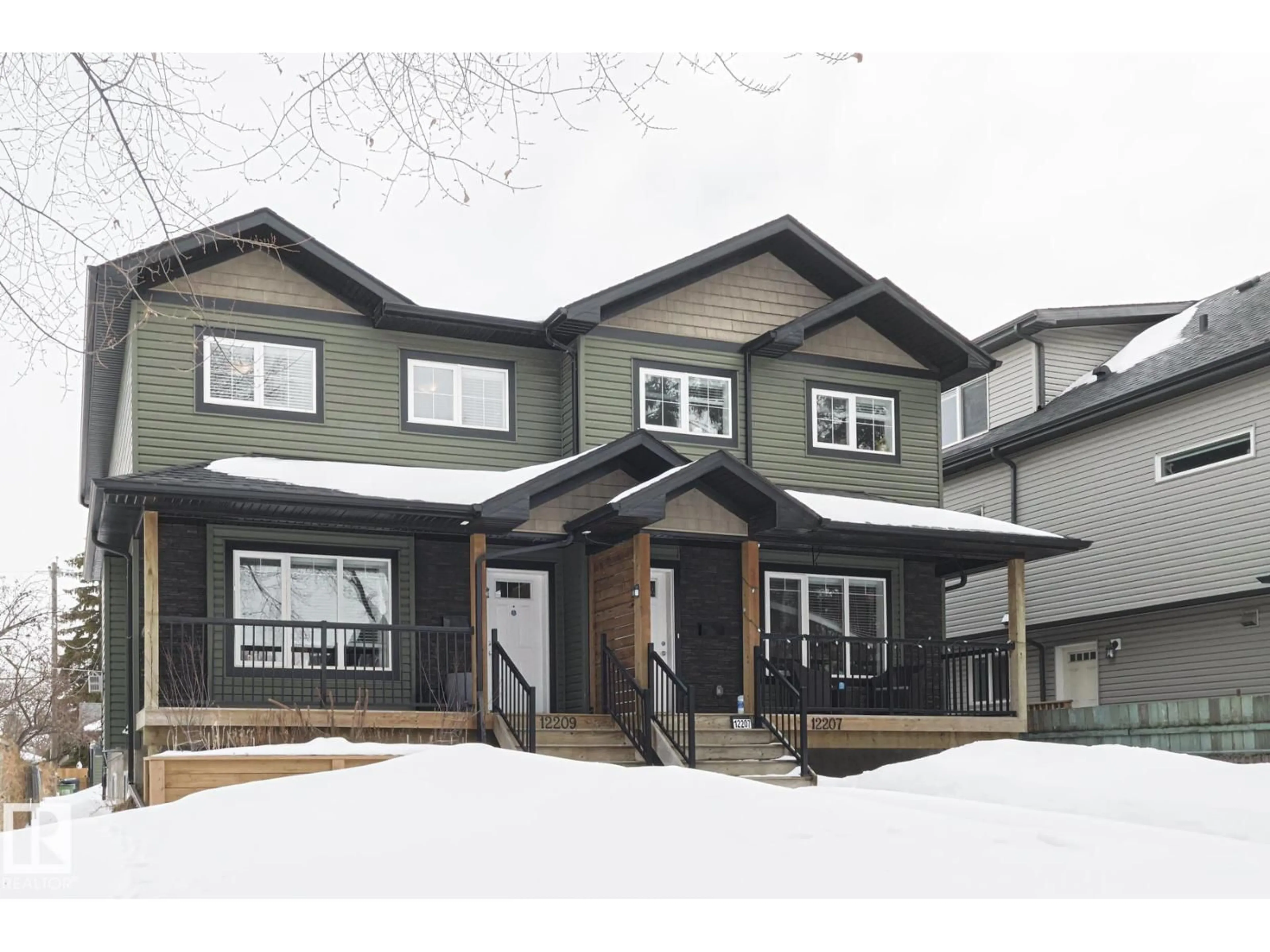 Home with vinyl exterior material, street for 12209 103 ST NW, Edmonton Alberta T5G2K2