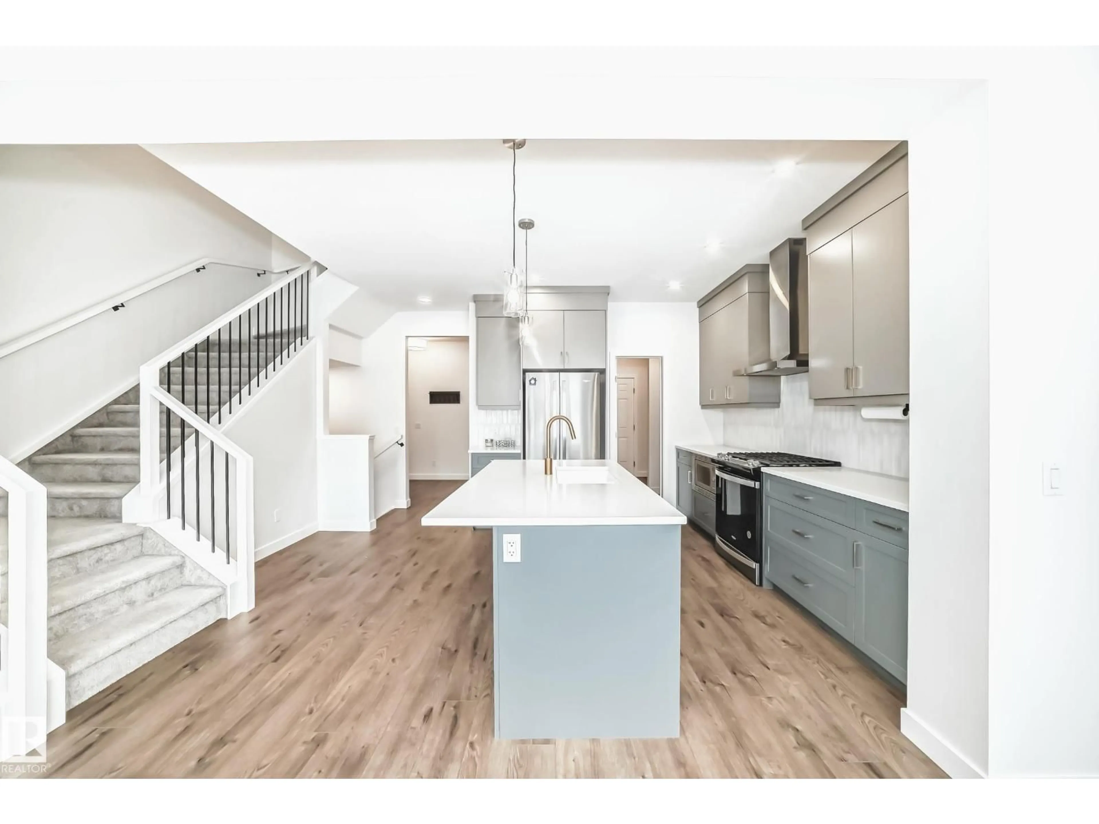 Open concept kitchen, wood/laminate floor for GR SW - 2896 COUGHLAN GREEN, Edmonton Alberta T6W4B2