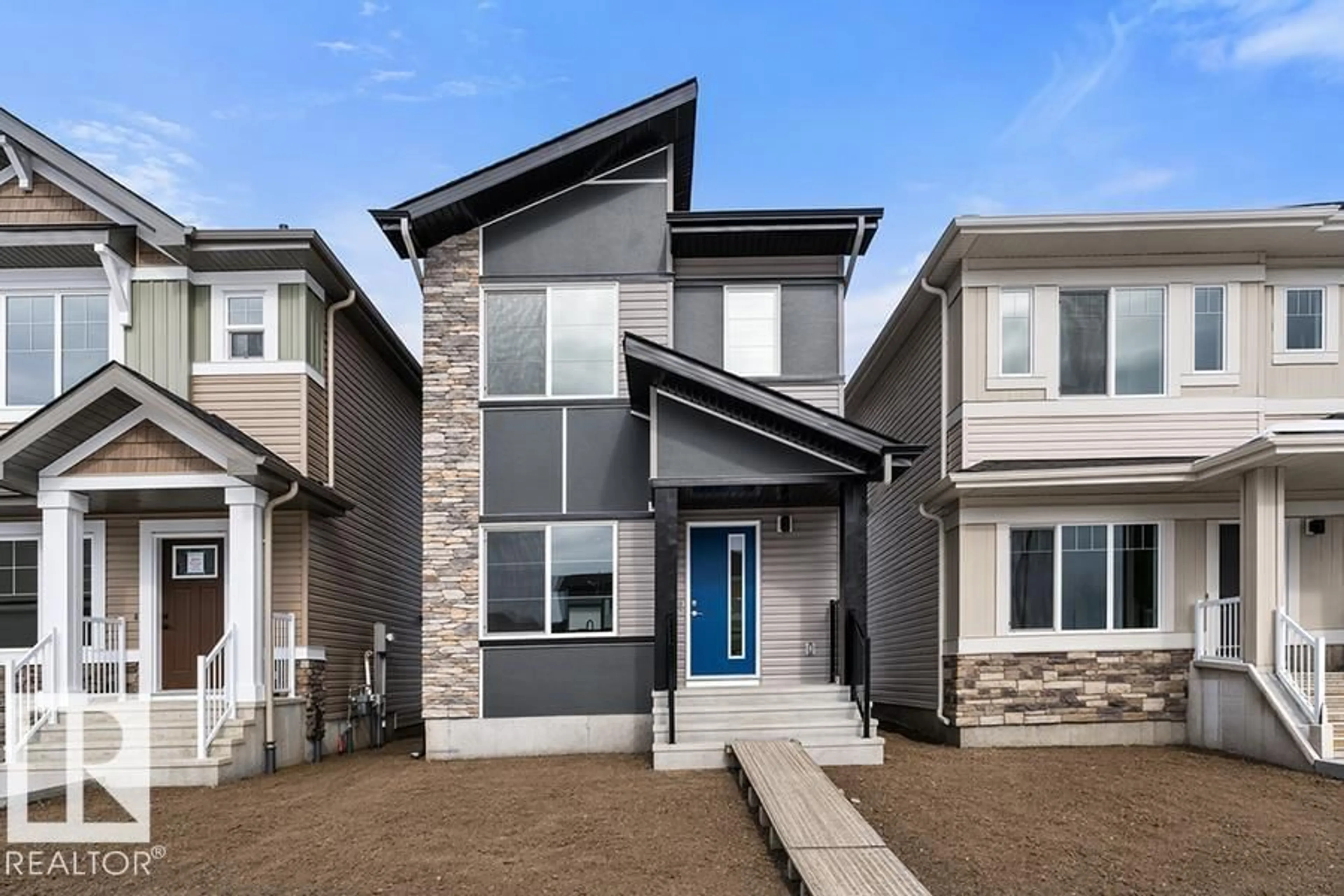 Home with vinyl exterior material, street for 18816 28 AV, Edmonton Alberta T6M3J1