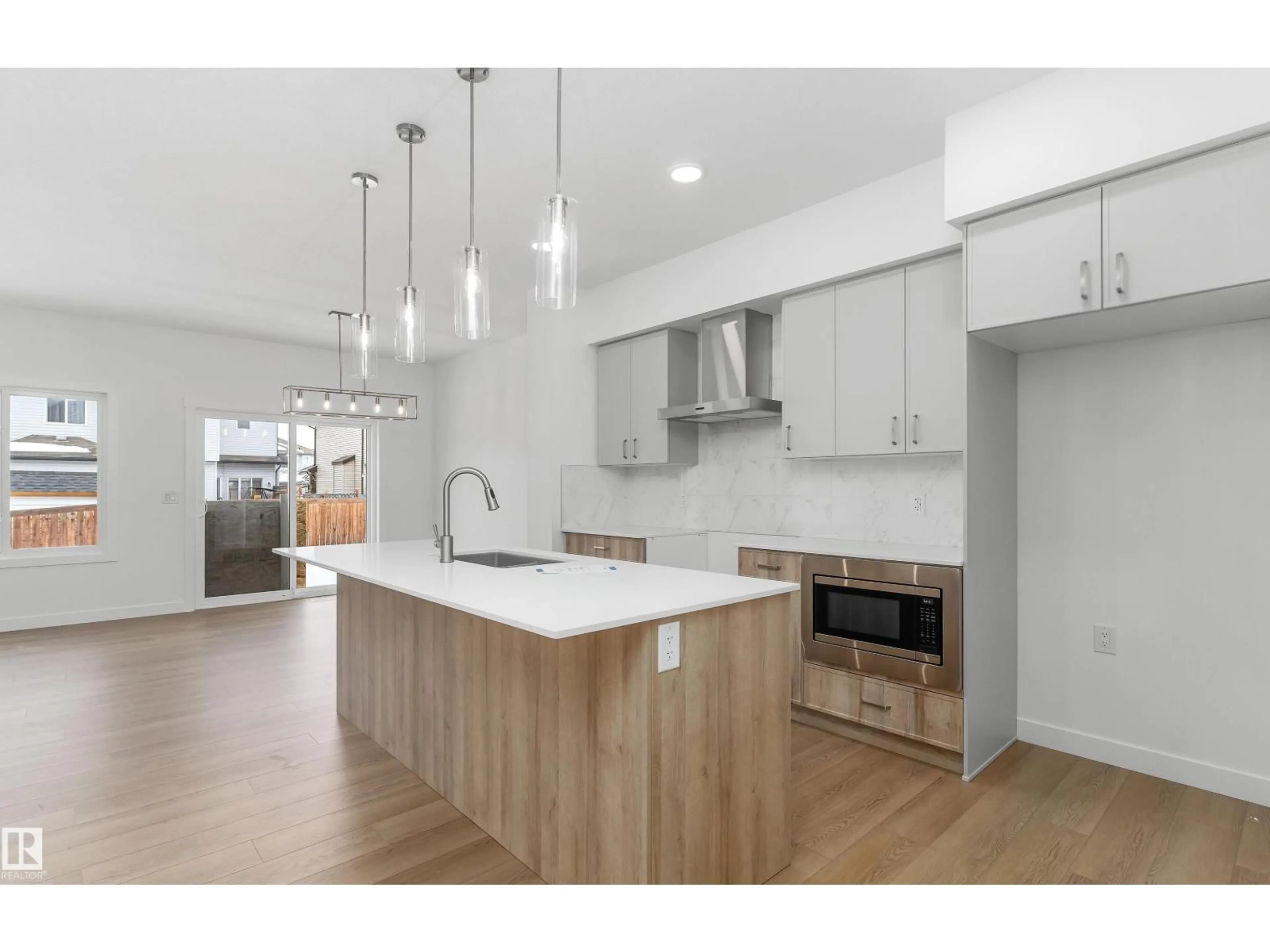 Open concept kitchen, wood/laminate floor for 1194 SOUTH CREEK WD, Stony Plain Alberta T7Z0P5