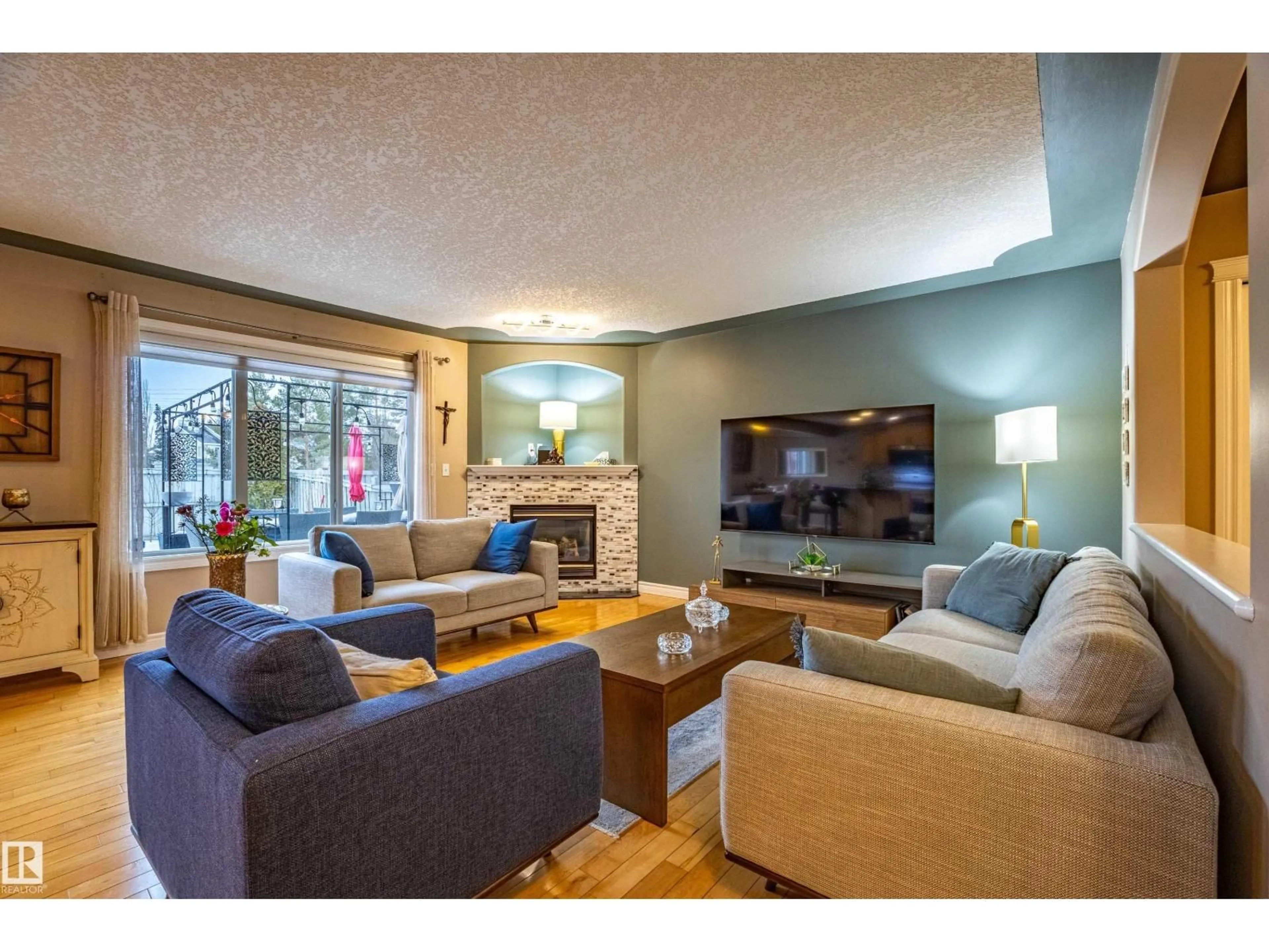 Living room with furniture, wood/laminate floor for 2721 MILES PL, Edmonton Alberta T6W0B3