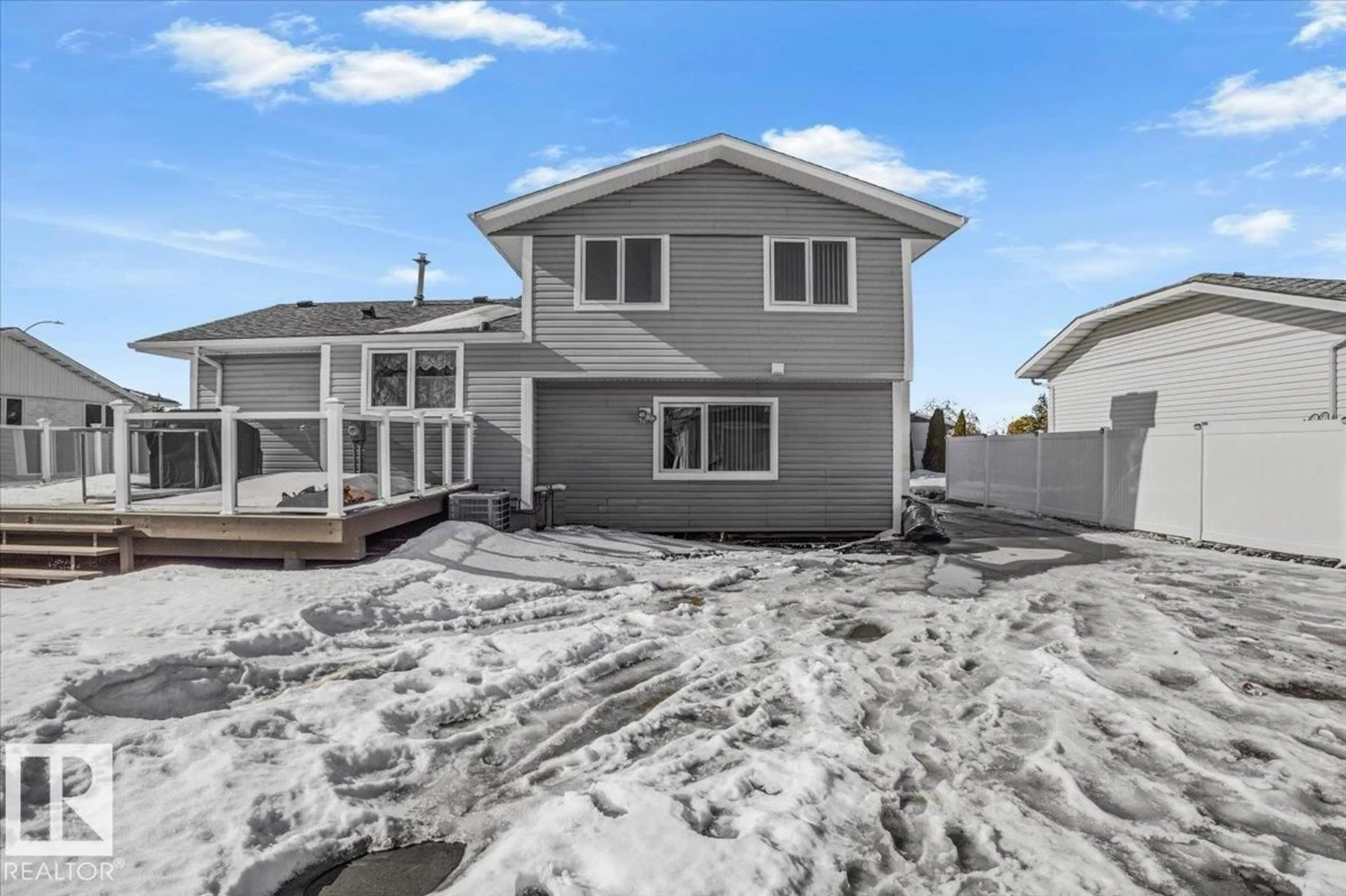 Home with vinyl exterior material, street for 12811 45 ST, Edmonton Alberta T5A2K3