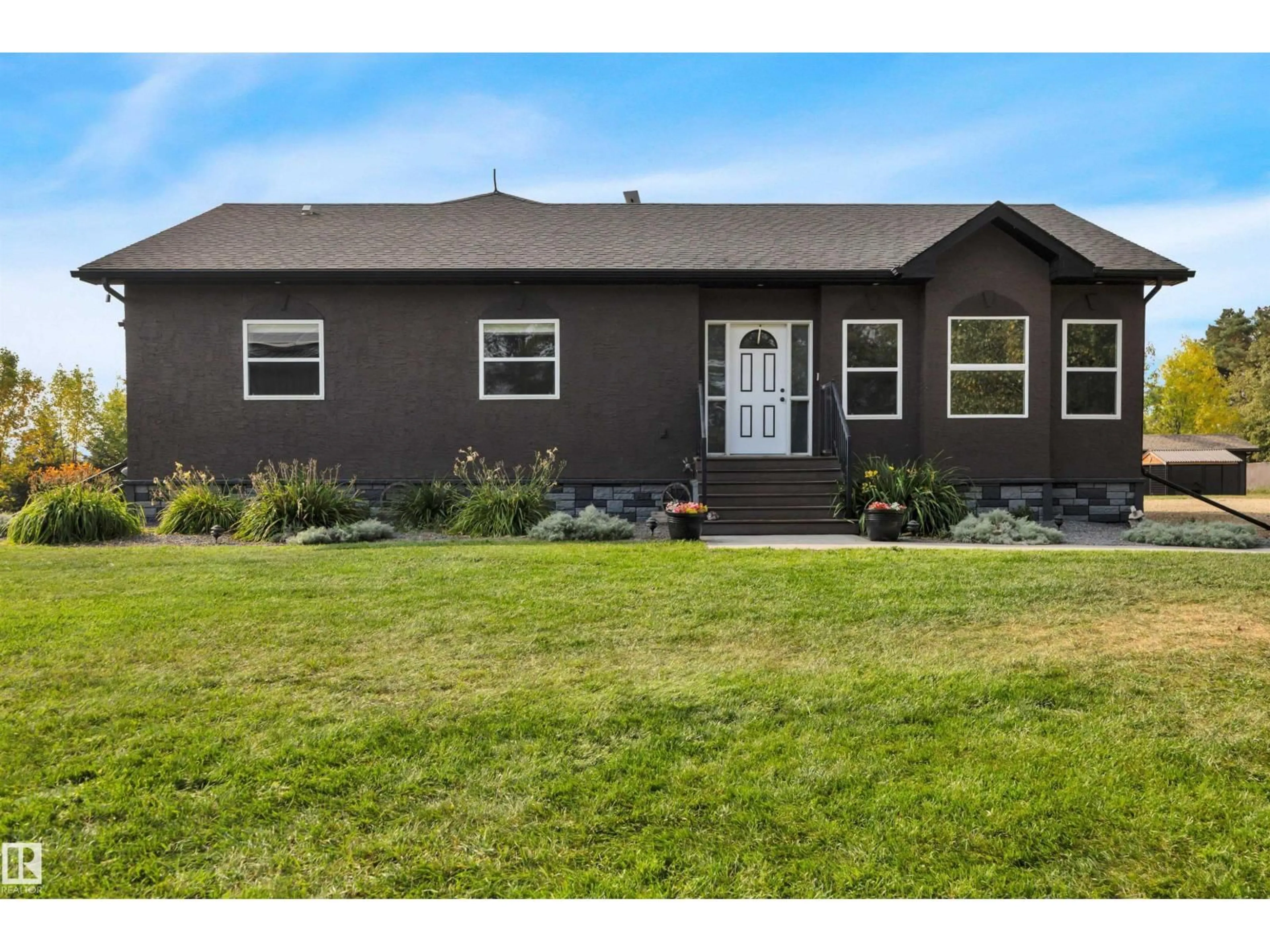 Home with vinyl exterior material, street for 250023 TWP ROAD 480, Rural Wetaskiwin County Alberta T0C1Z0