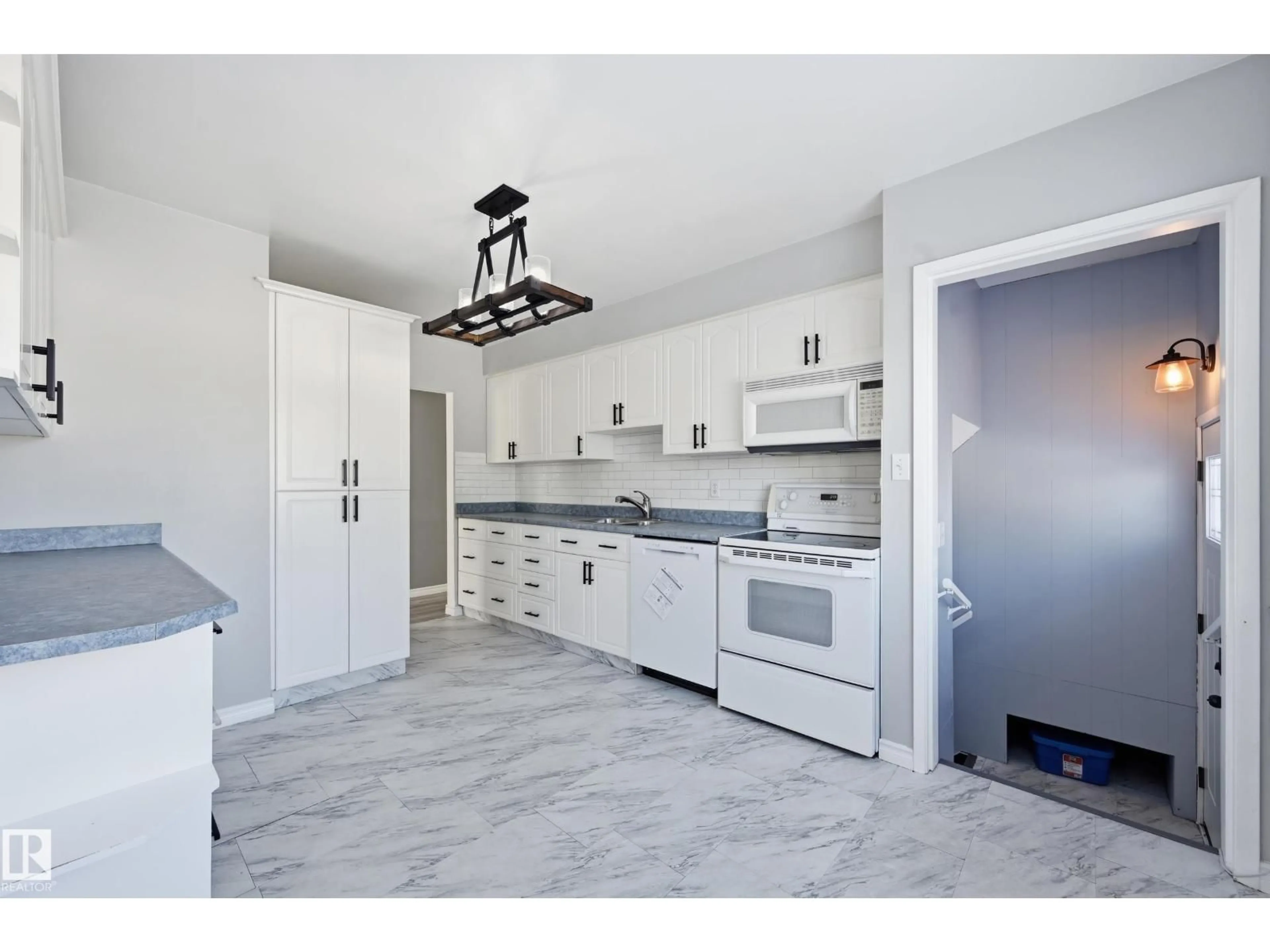 Open concept kitchen, ceramic/tile floor for 13439 103 ST, Edmonton Alberta T5E4M7