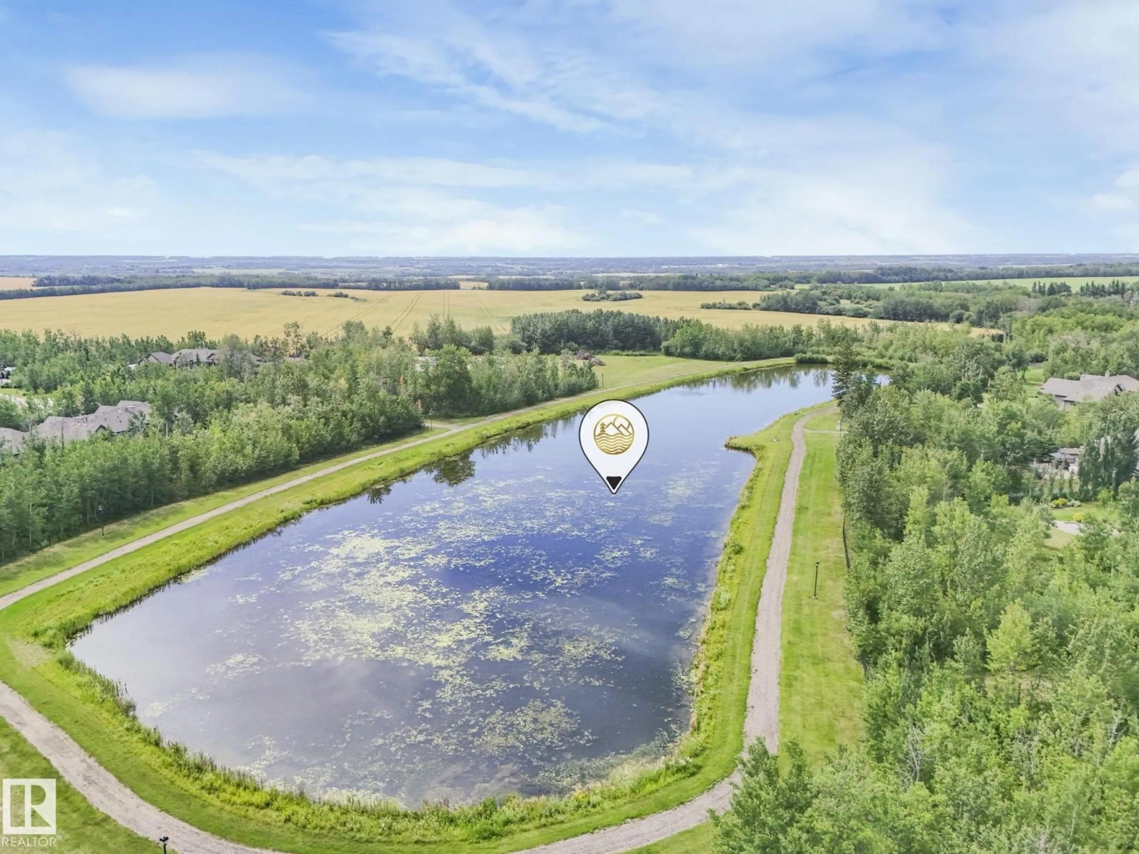 A pic from outside/outdoor area/front of a property/back of a property/a pic from drone, water/lake/river/ocean view for 9A - 53521 RGE ROAD 272, Rural Parkland County Alberta T7X3M5