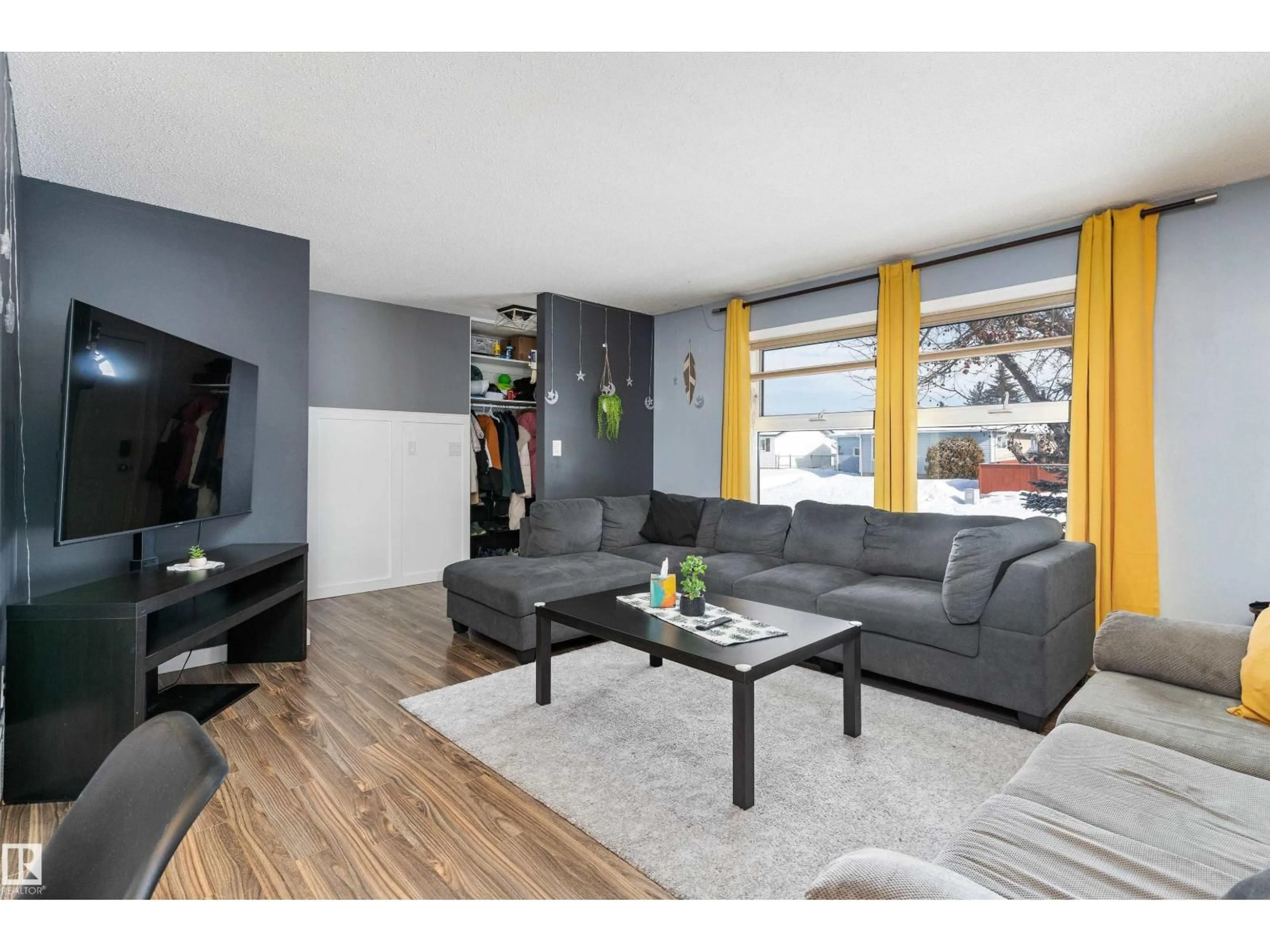 Living room with furniture, wood/laminate floor for NW - 14608 117A ST, Edmonton Alberta T5X1K2