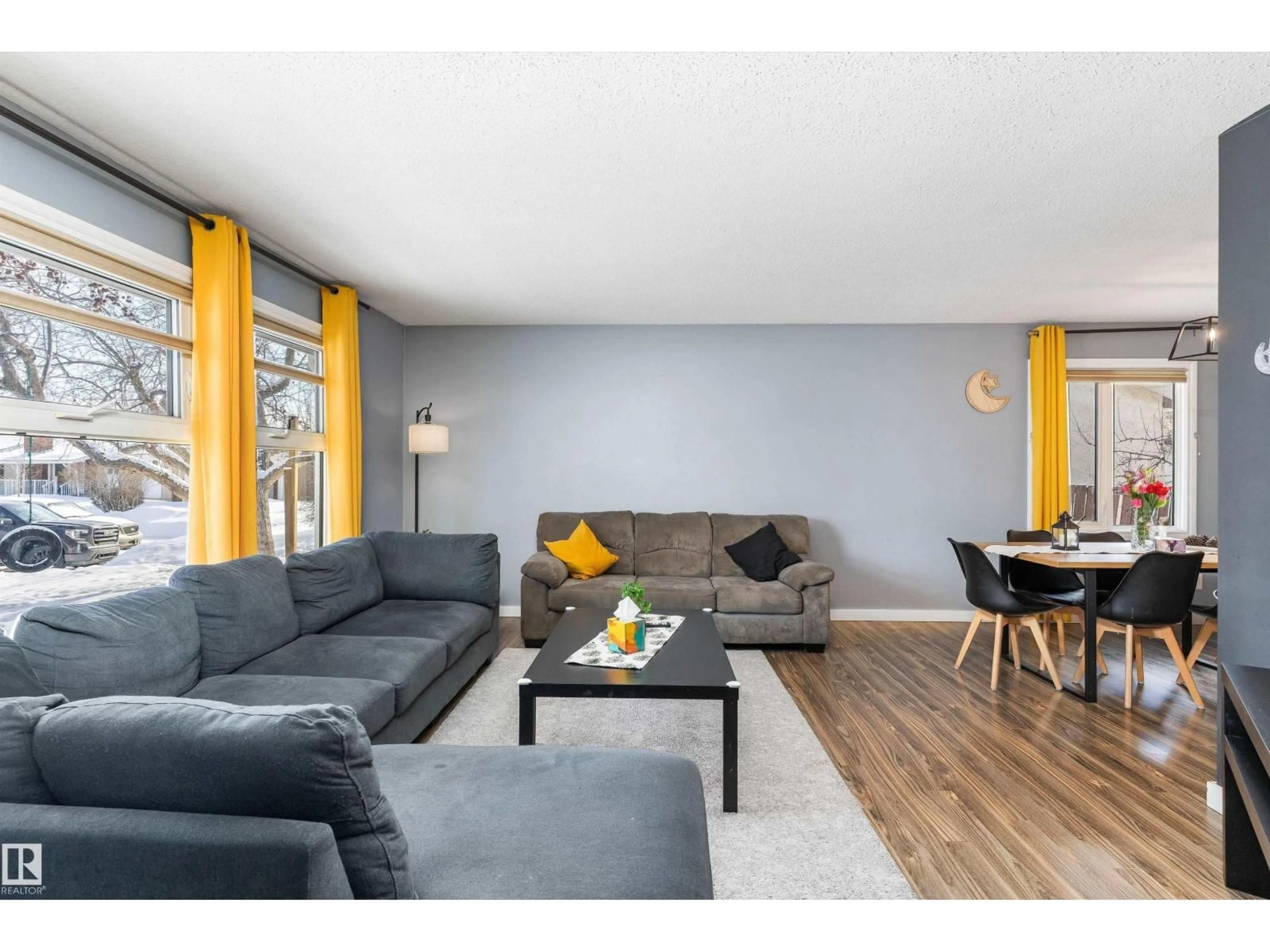 Living room with furniture, wood/laminate floor for NW - 14608 117A ST, Edmonton Alberta T5X1K2
