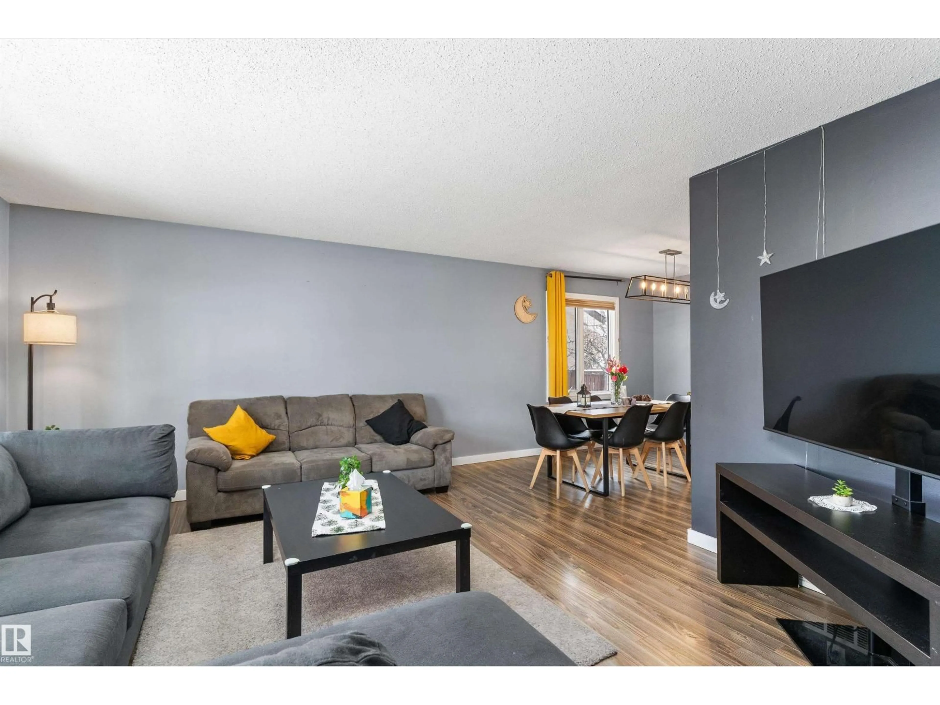 Living room with furniture, wood/laminate floor for NW - 14608 117A ST, Edmonton Alberta T5X1K2