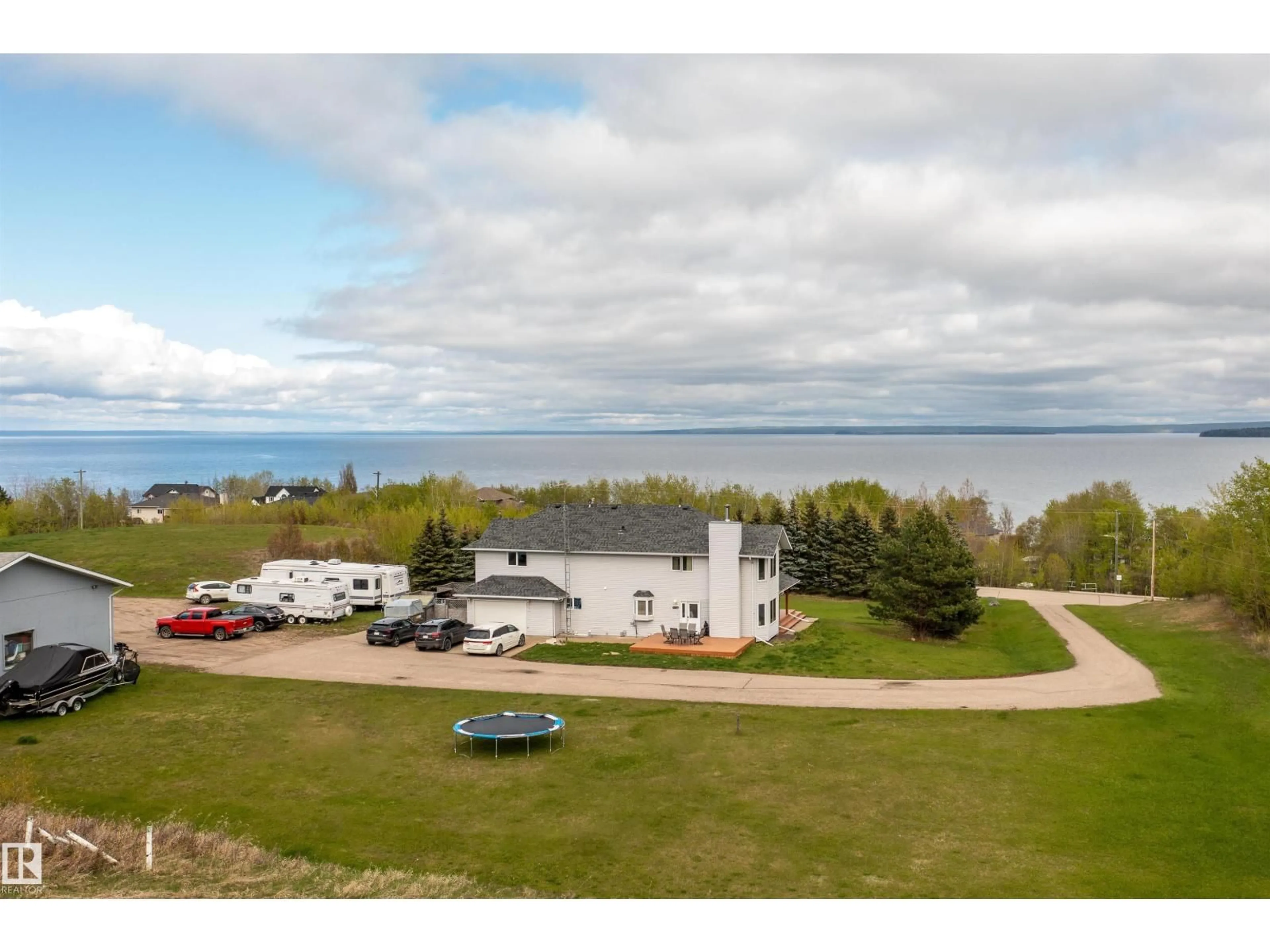 A pic from outside/outdoor area/front of a property/back of a property/a pic from drone, water/lake/river/ocean view for 1301 28 ST, Cold Lake Alberta T9M1G2