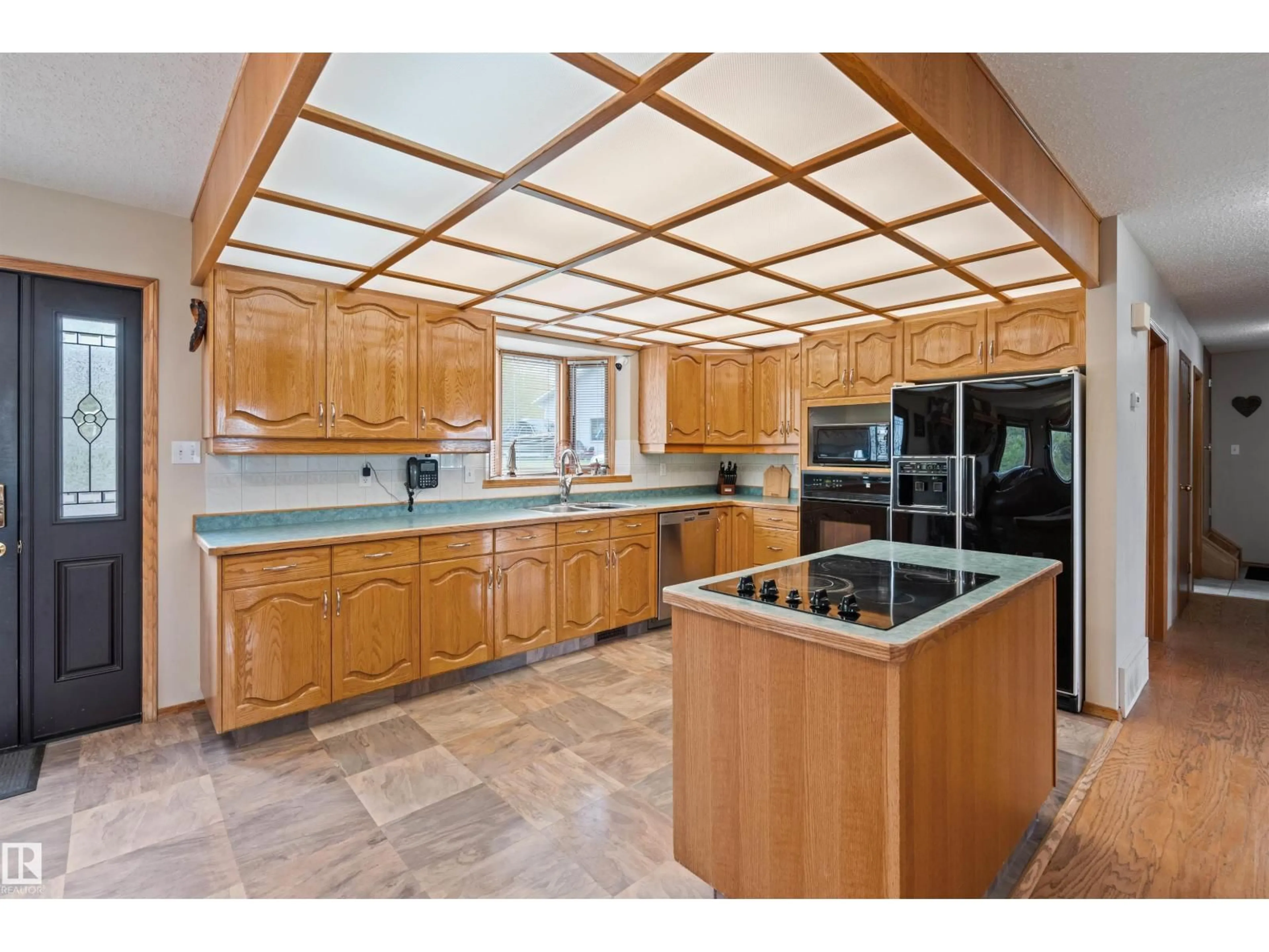 Open concept kitchen, ceramic/tile floor for 1301 28 ST, Cold Lake Alberta T9M1G2