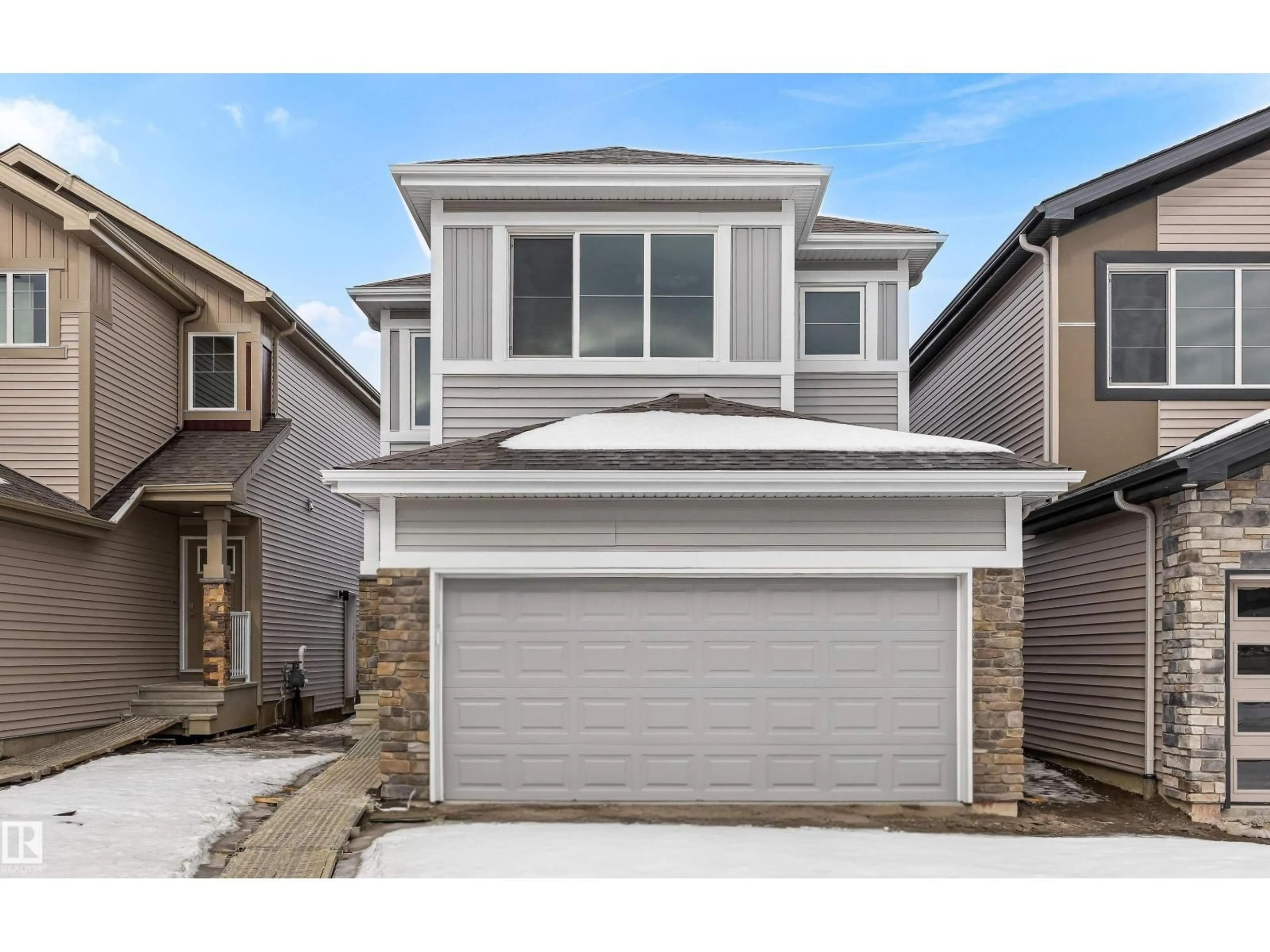 Home with vinyl exterior material, street for 8728 183 AV, Edmonton Alberta T5Z0S8