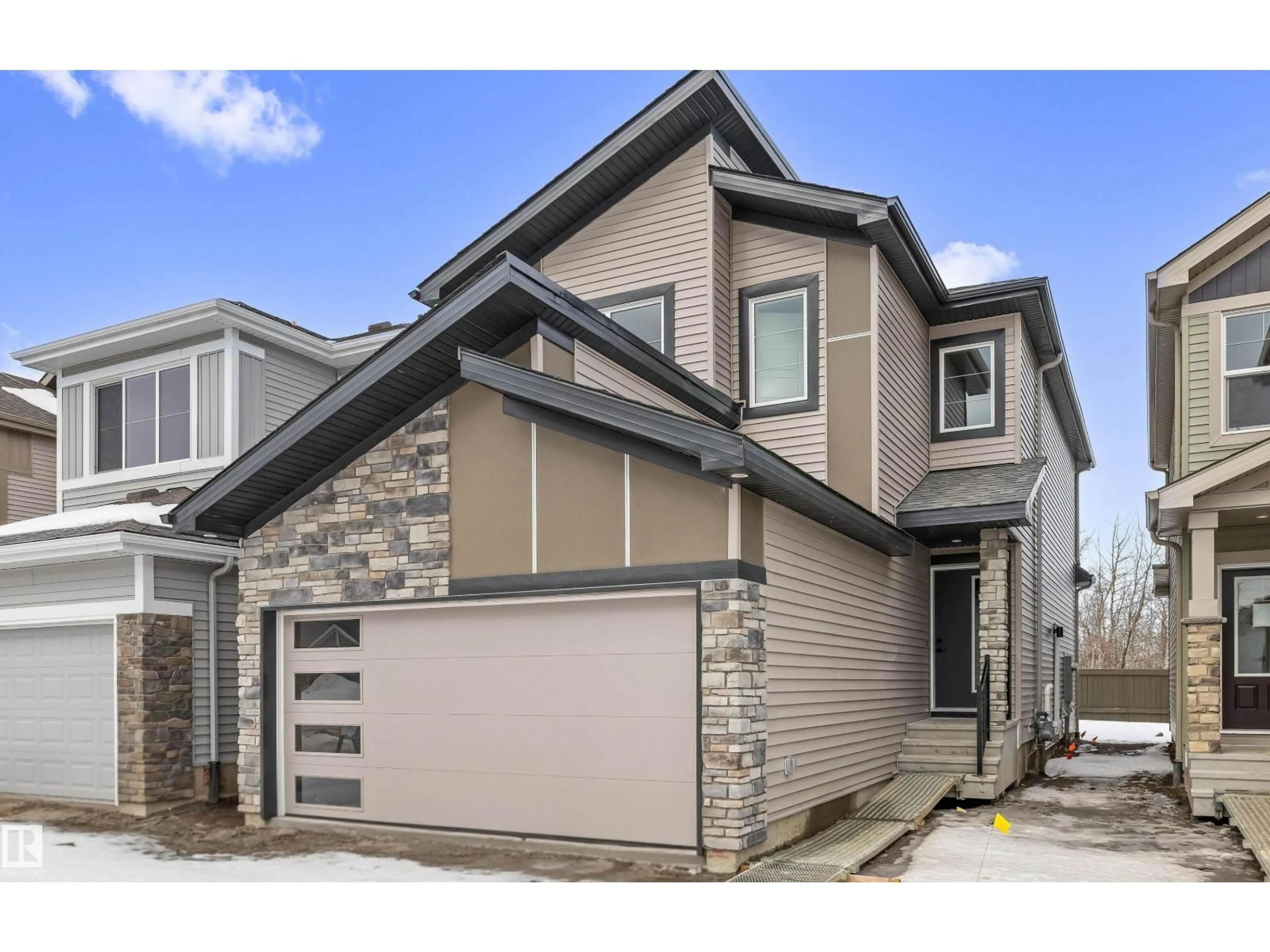 Home with vinyl exterior material, street for 8724 183 AV, Edmonton Alberta T5Z0S8