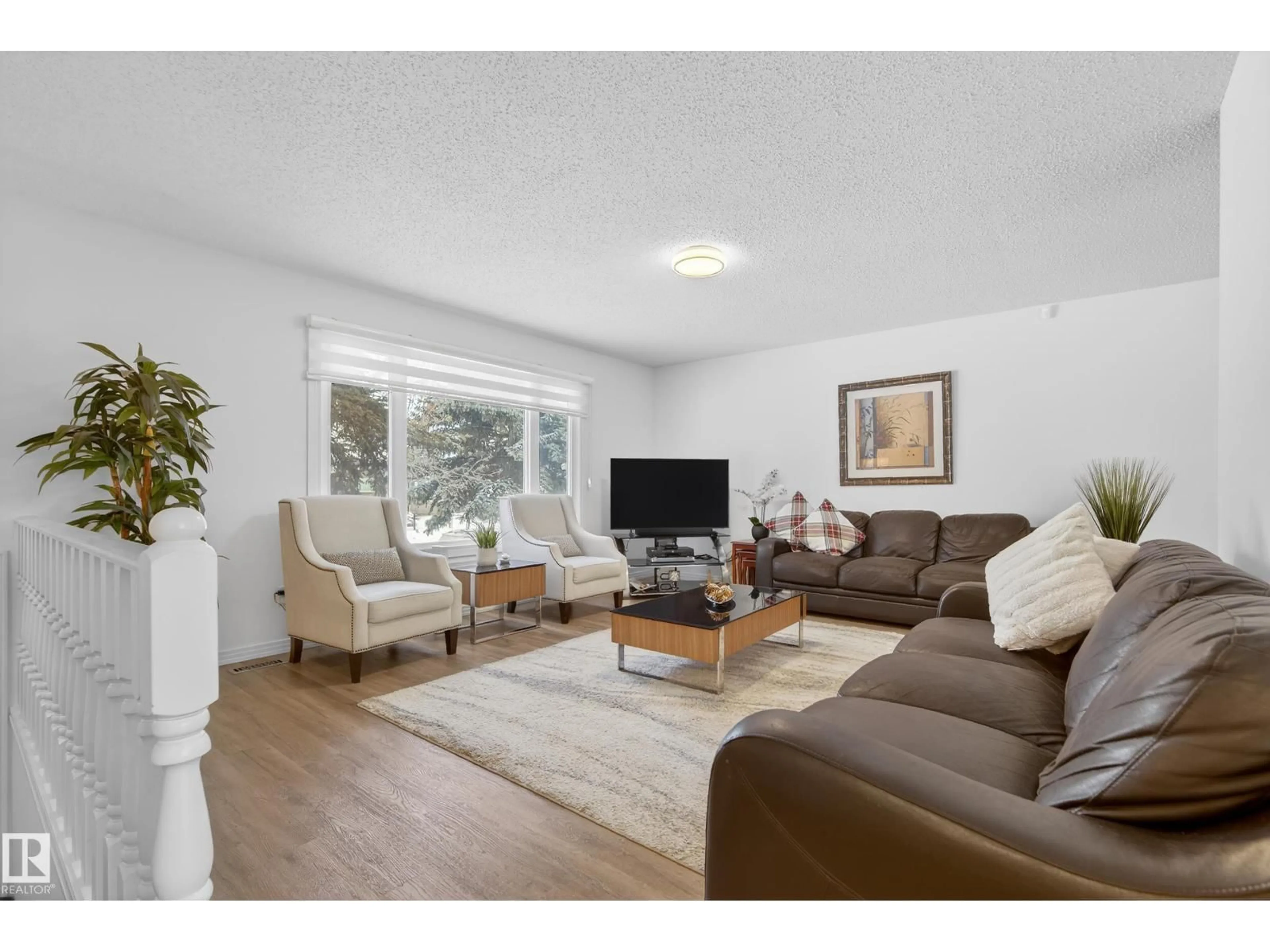 Living room with furniture, wood/laminate floor for 17303 101 ST, Edmonton Alberta T5X0B6