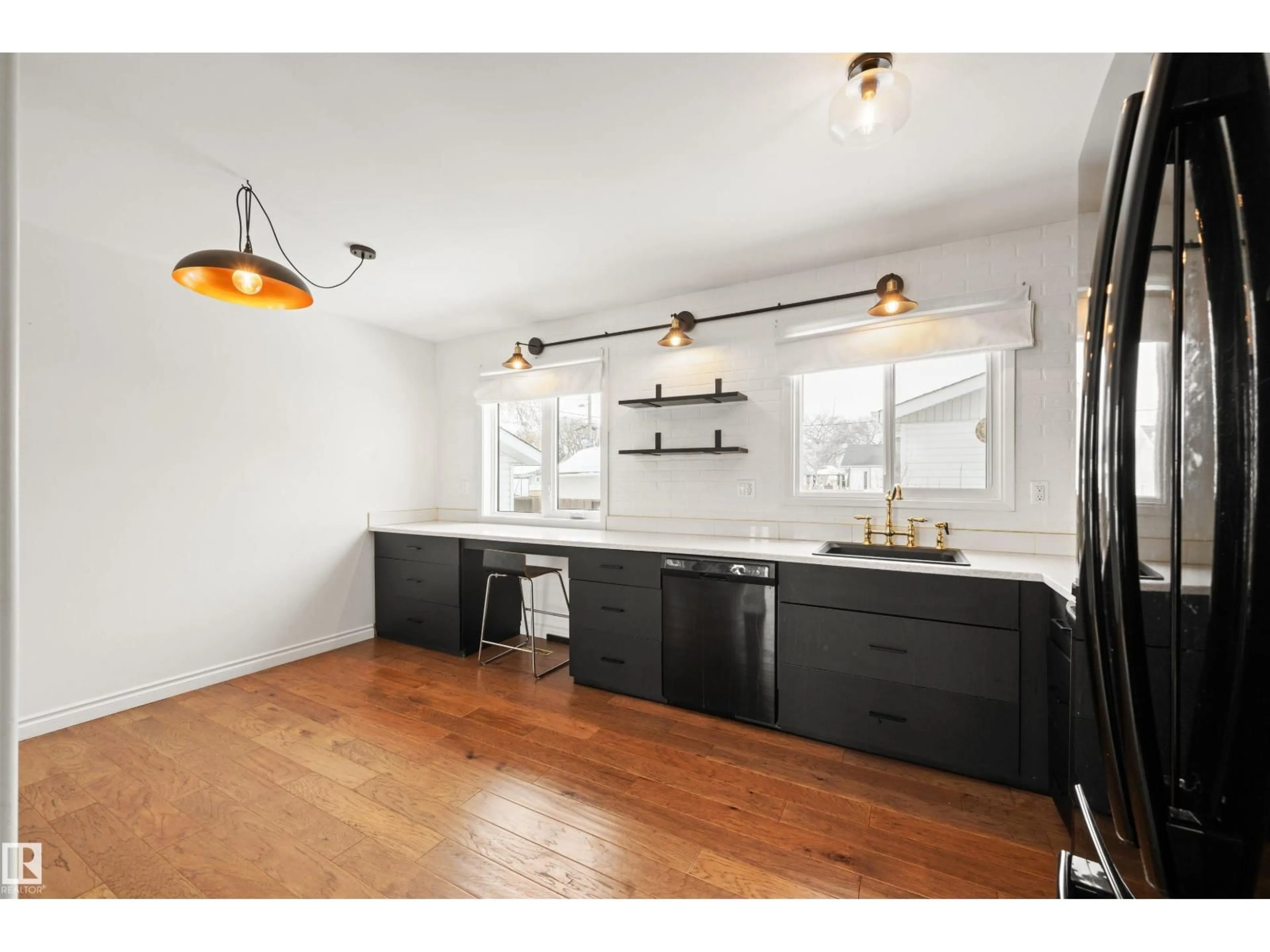 Open concept kitchen, wood/laminate floor for NW - 11052 151 ST, Edmonton Alberta T5P1W3