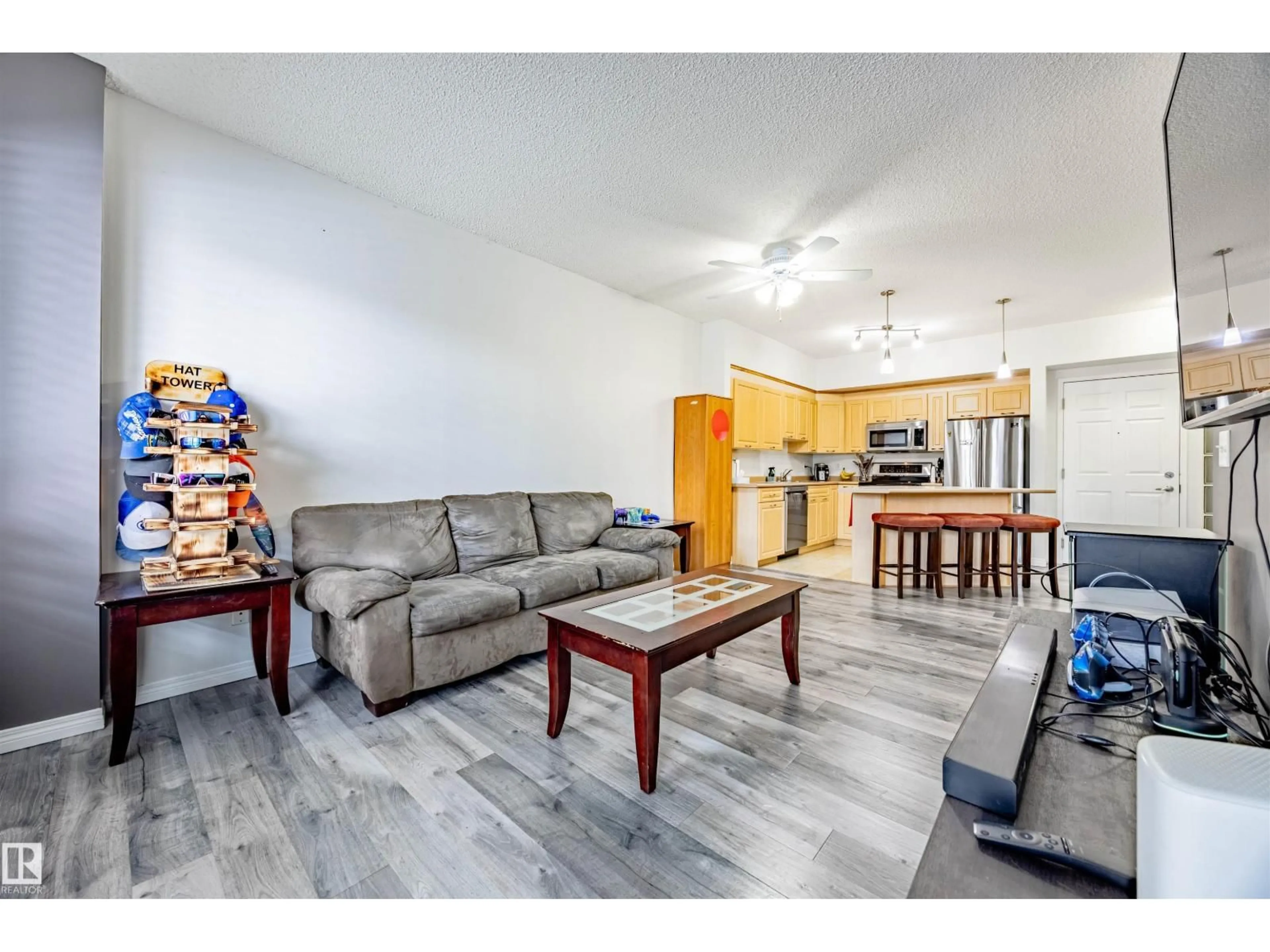 Living room with furniture, wood/laminate floor for 6220 - 132 134 AV, Edmonton Alberta T5A0A8