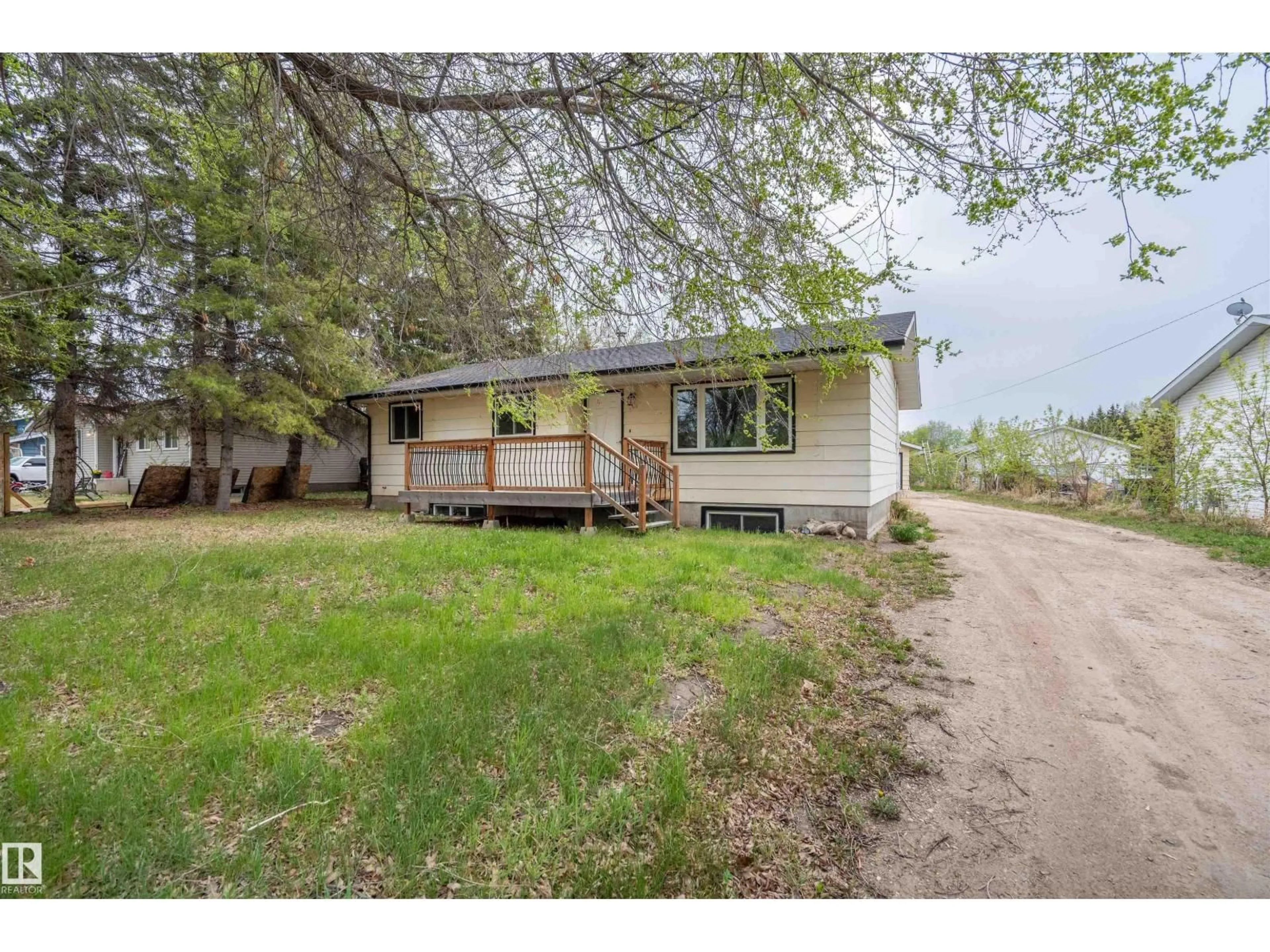 A pic from outside/outdoor area/front of a property/back of a property/a pic from drone, street for 405 - 61314 RR 463, Rural Bonnyville M.D. Alberta T9N2G9